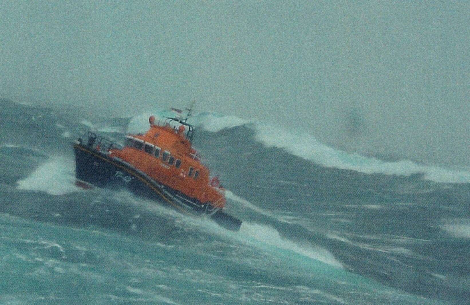 In rough weather on 27 August 2004, the Norwegian fish carrier Arnoytrans lost steering when her rudder jammed. The vessel was only about 2 miles from Stroma when the Thurso lifeboat, The Taylors, under deputy coxswain Dougie Munro took her in tow. This photo of the lifeboat, taken by the Norwegian skipper Henrick Steffenson, shows the high seas in the Firth.