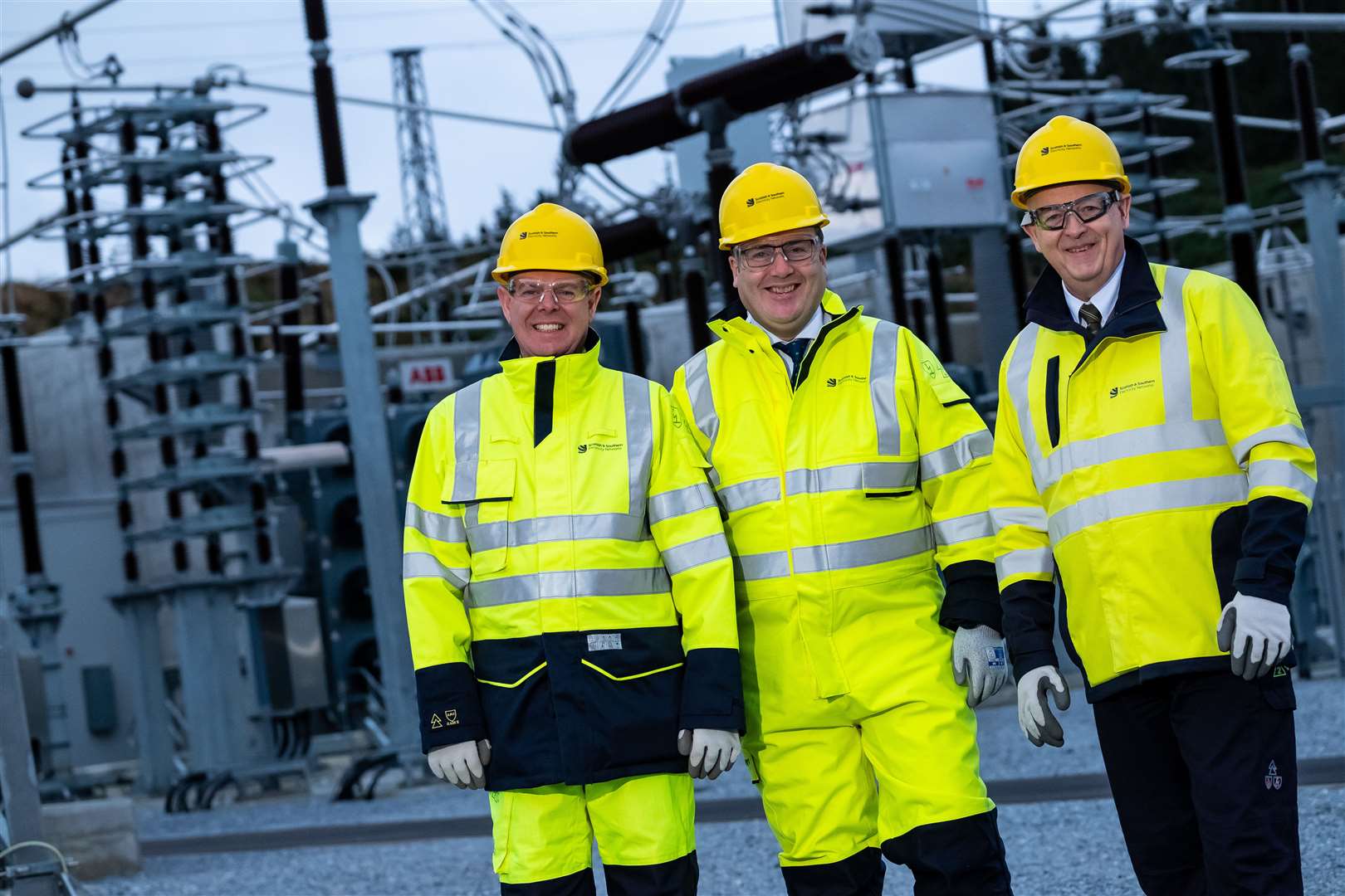 Paul Wheelhouse (centre) with Rob McDonald (left) and Colin Nicol from SSEN at Blackhillock substation in December. Picture: Stuart Nicol Photography