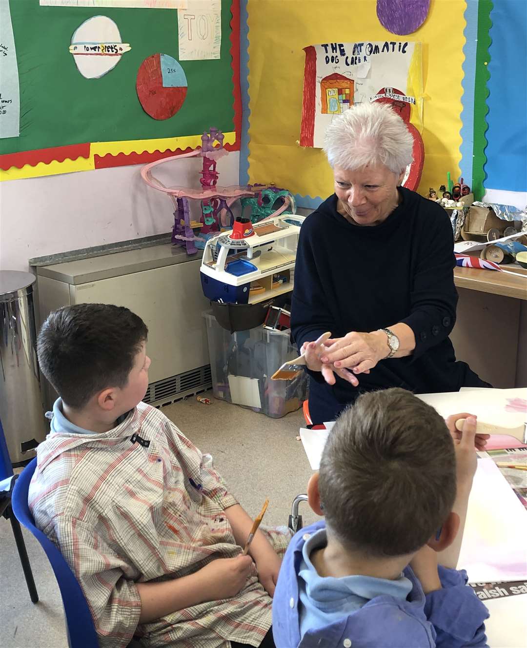 John Gunn (P3) learns to paint with his granny.