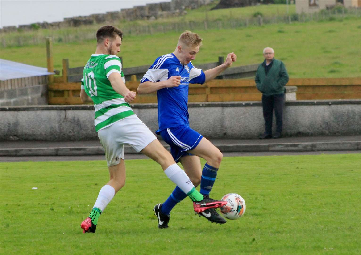 Castletown's Connor Macleod tries to dispossess Carter Mackay (Keiss).