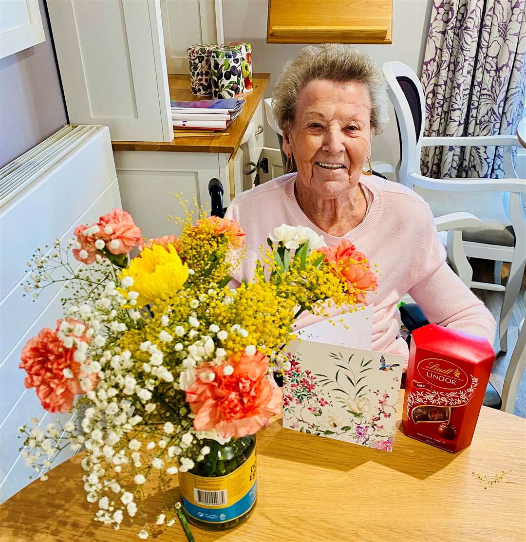 Rita with her Valentine's gifts from Bruce.