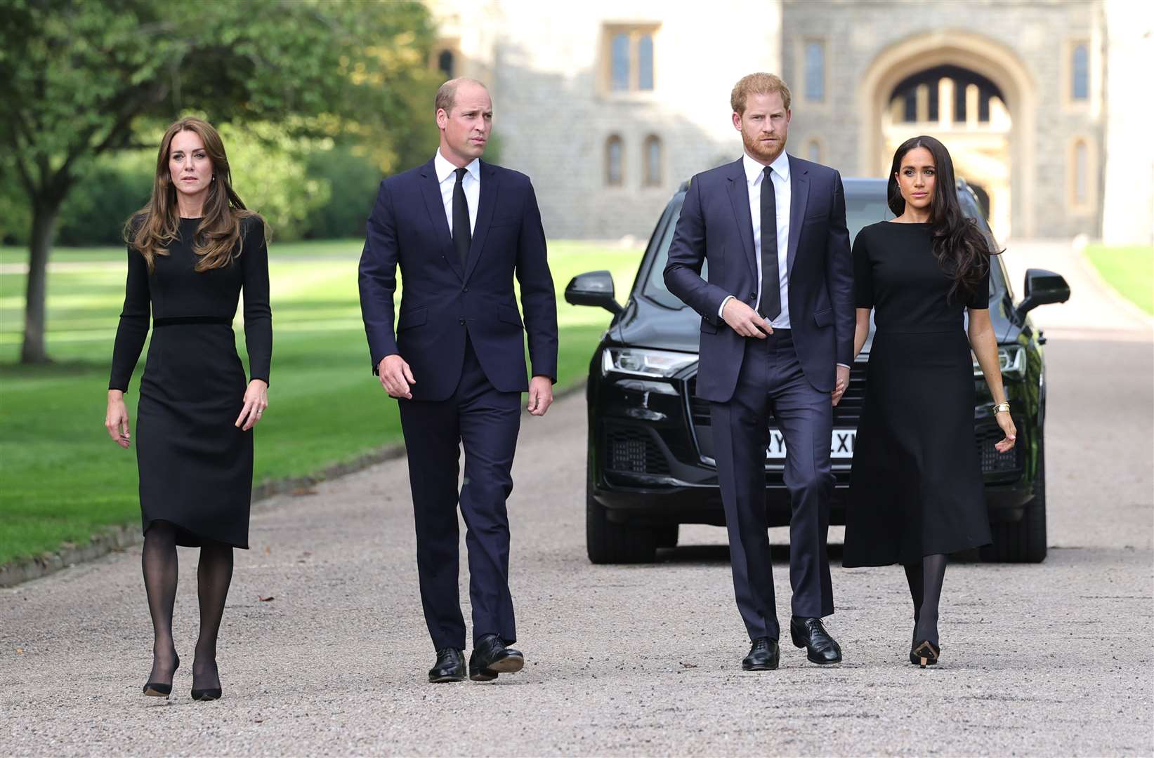 The now Princess of Wales, the Prince of Wales and the Duke and Duchess of Sussex walk to meet members of the public at Windsor Castle in Berkshire following the death of the Queen (Chris Jackson/PA)