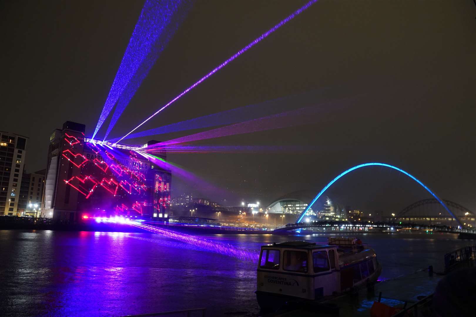 Laser lights projected onto the Baltic Centre for Contemporary Art in Gateshead (Owen Humphreys/PA)