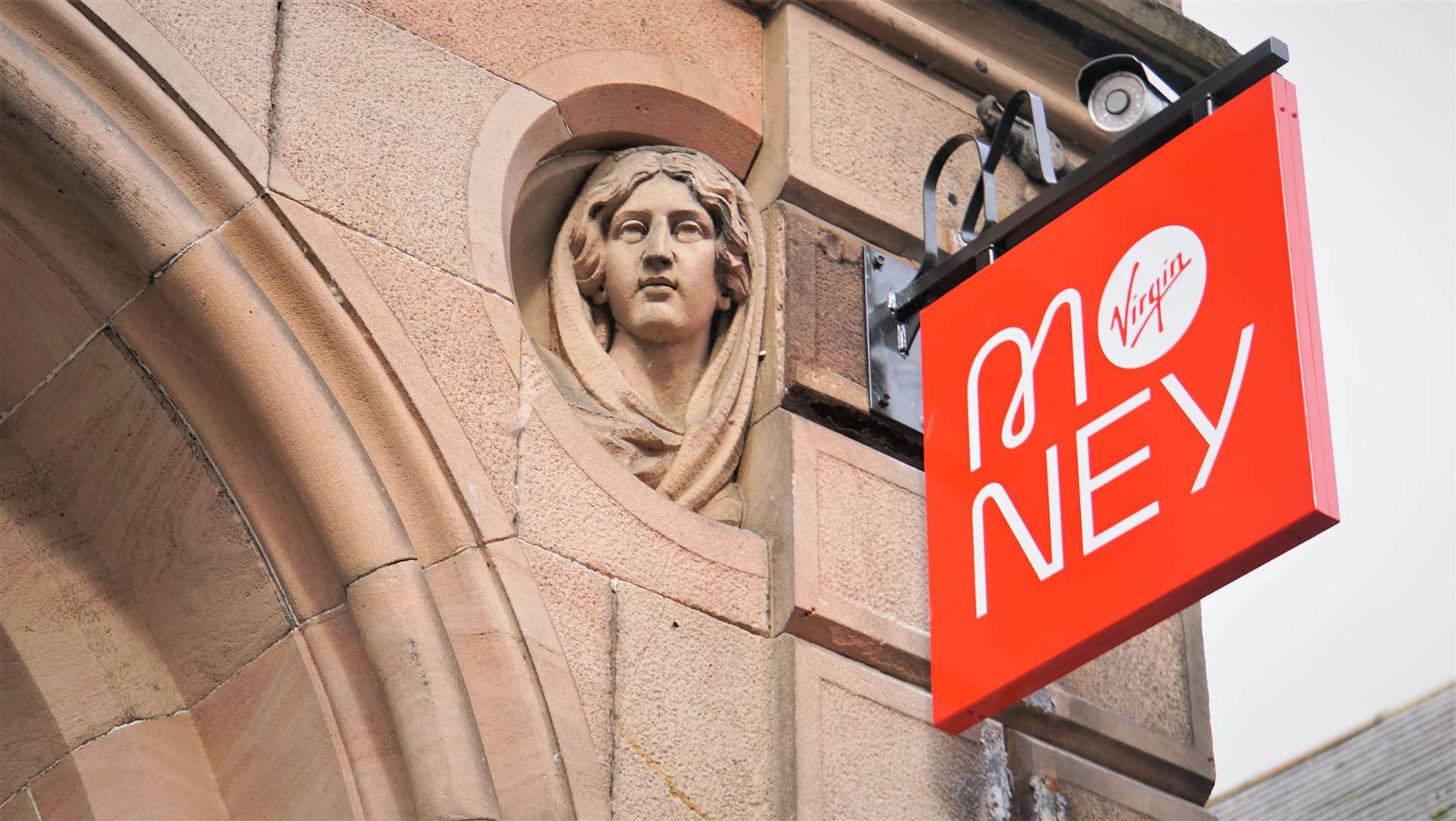 The old sits next to the new on the façade of 30 Bridge Street as the bust of Flora MacDonald looks down next to the new Virgin Money sign. Pictures: DGS