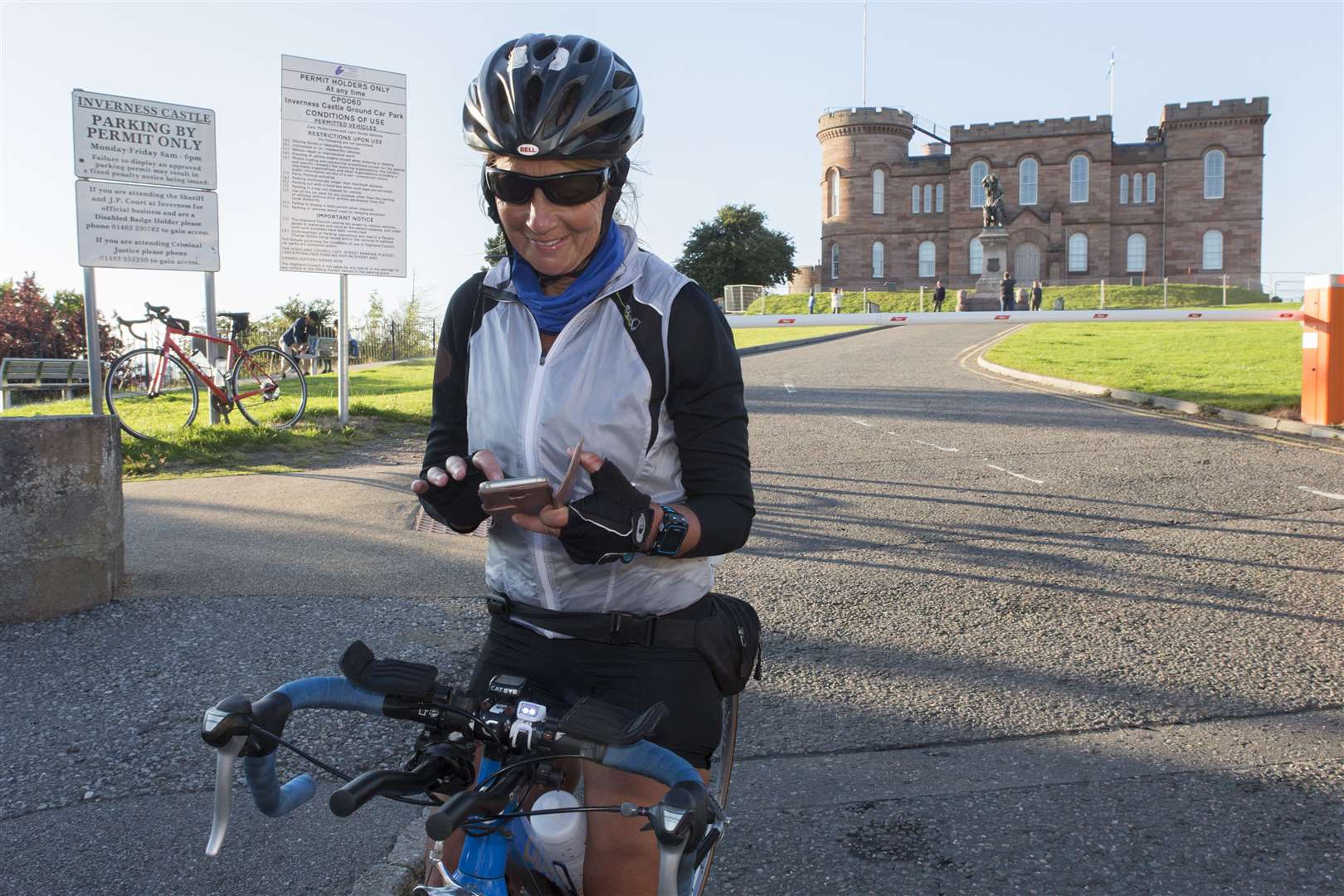 Arriving in Inverness at 6.21pm, Lorna updates her social media as she completes the NC500 cycle part of her ultra duathlon. Picture: Robert MacDonald / Northern Studios