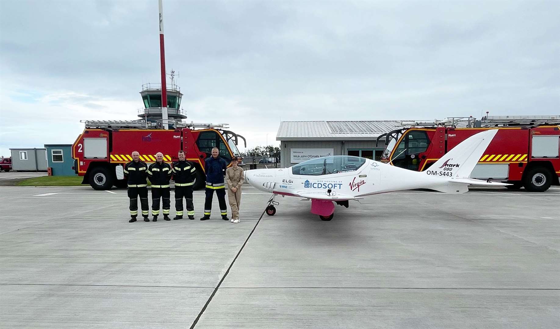 Zara Rutherford with HIAL firefighters at Wick.