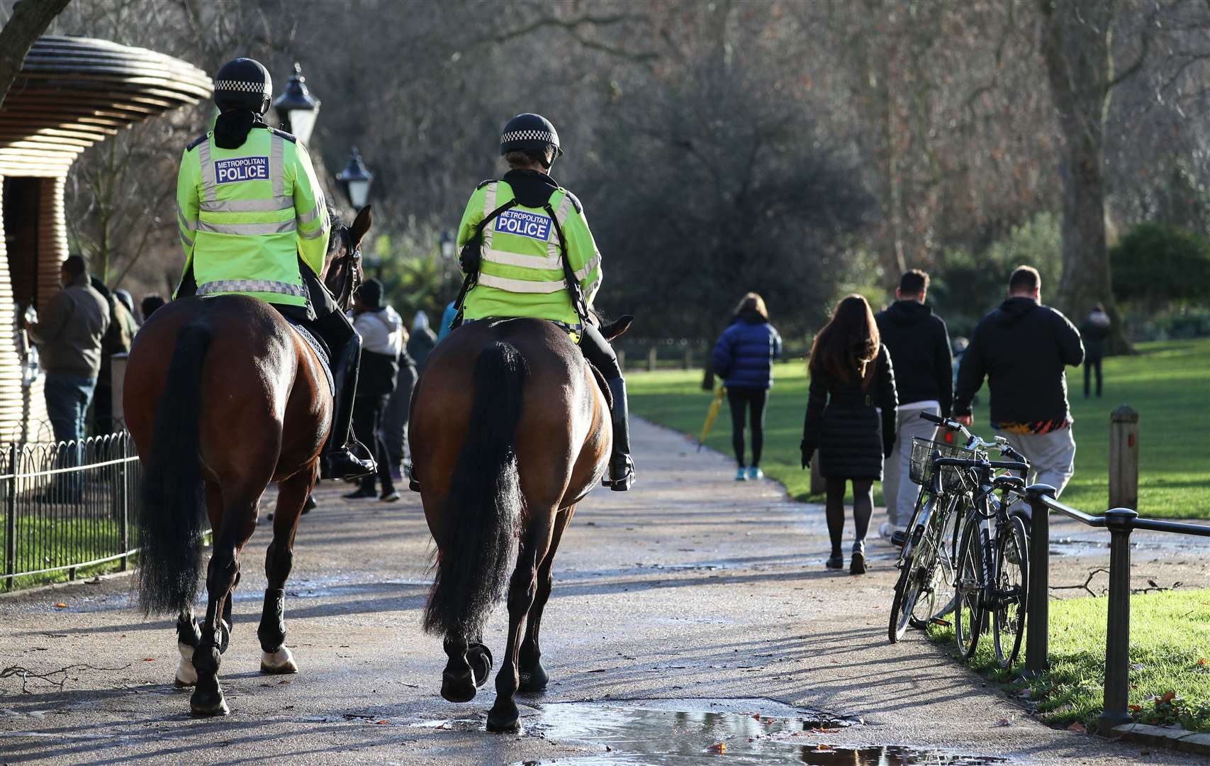 Police patrol on horseback through St James’ Park in London (Andrew Matthews/PA)