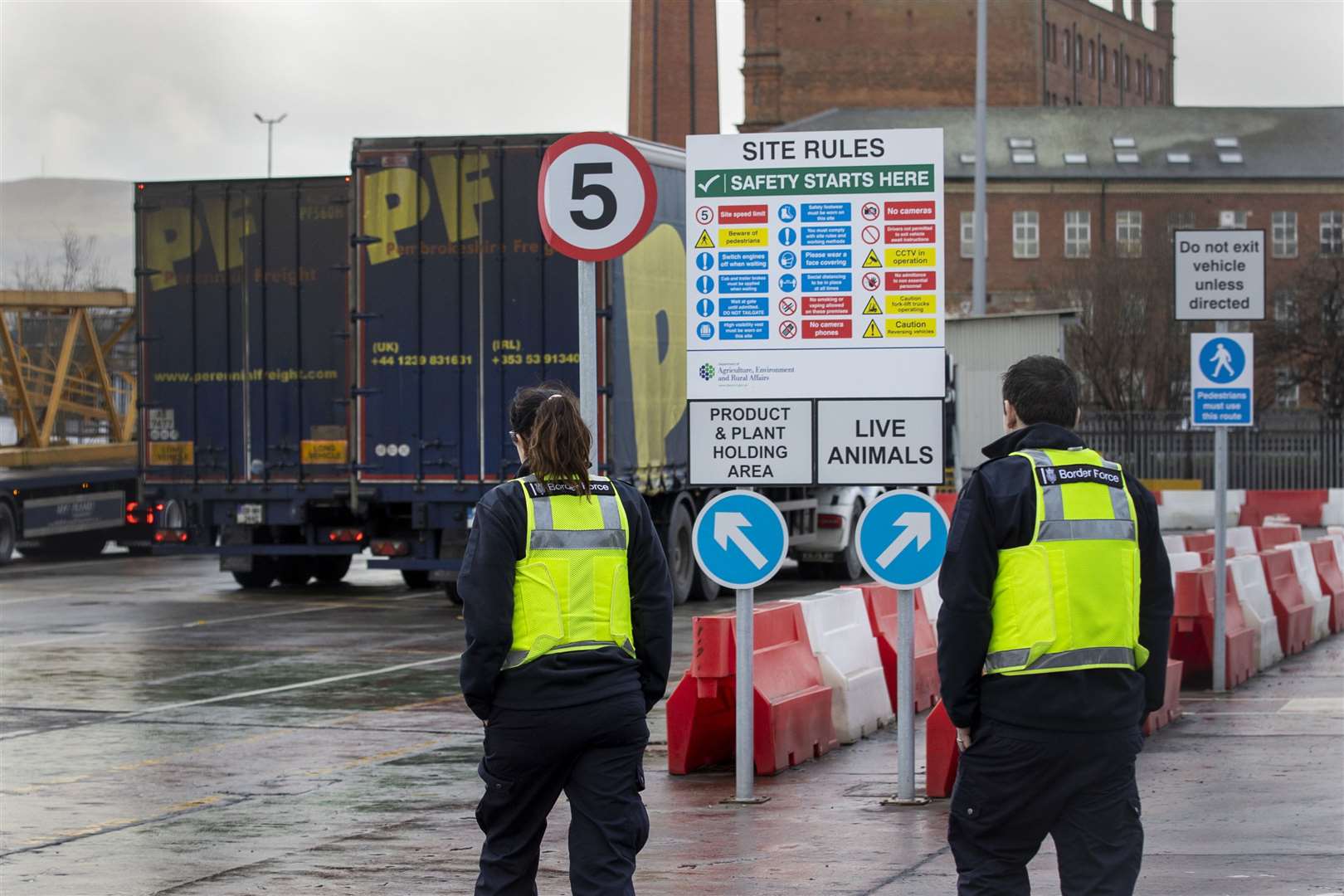 UK Border Force officers at checking facility at Belfast port (PA)