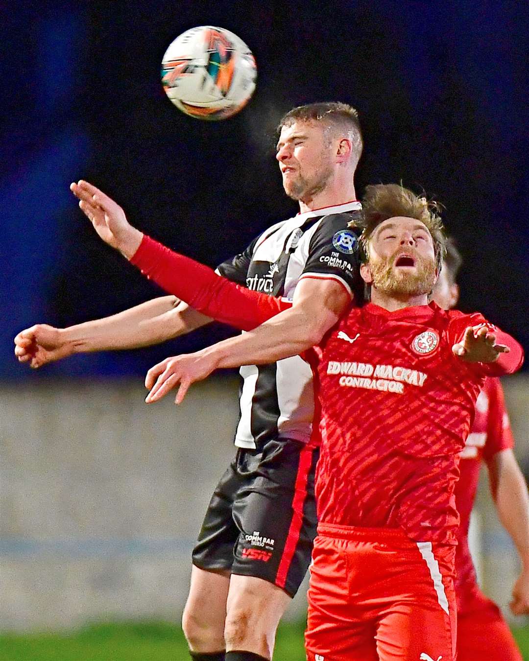 Wick Academy striker Marc Macgregor beats Brora's Dale Gillespie in an aerial challenge. Picture: Mel Roger