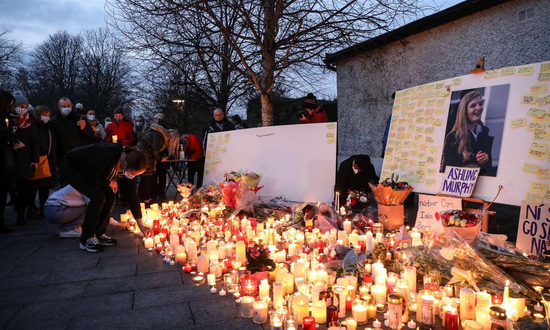Local people light candles after after a vigil in memory of Aisling Murphy in Tullamore town Park, County Offaly (Damien Eagers/PA)