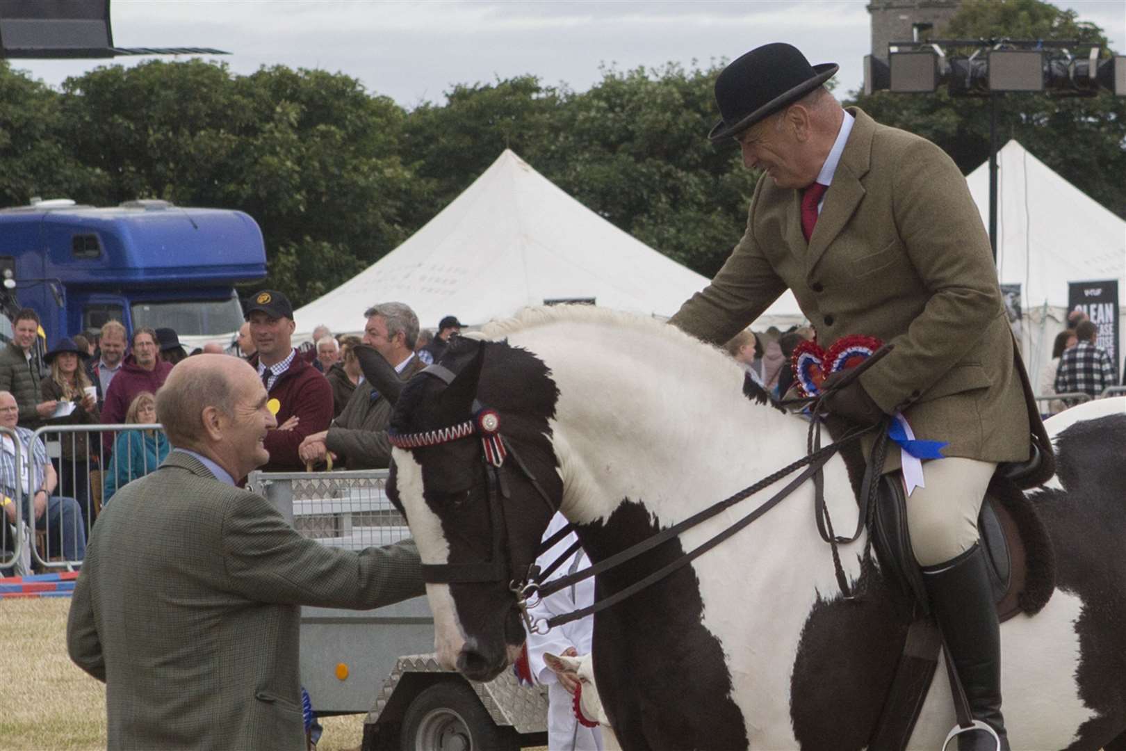 Retired Caithness vet Hamish McLean, who now lives in Aberlour, judged the champions of champions. He is pictured making the presentation to his choice, the supreme horse champion owned by Geraldine Harrold, Wick, and ridden by James Munro. Picture: Robert MacDonald / Northern Studios