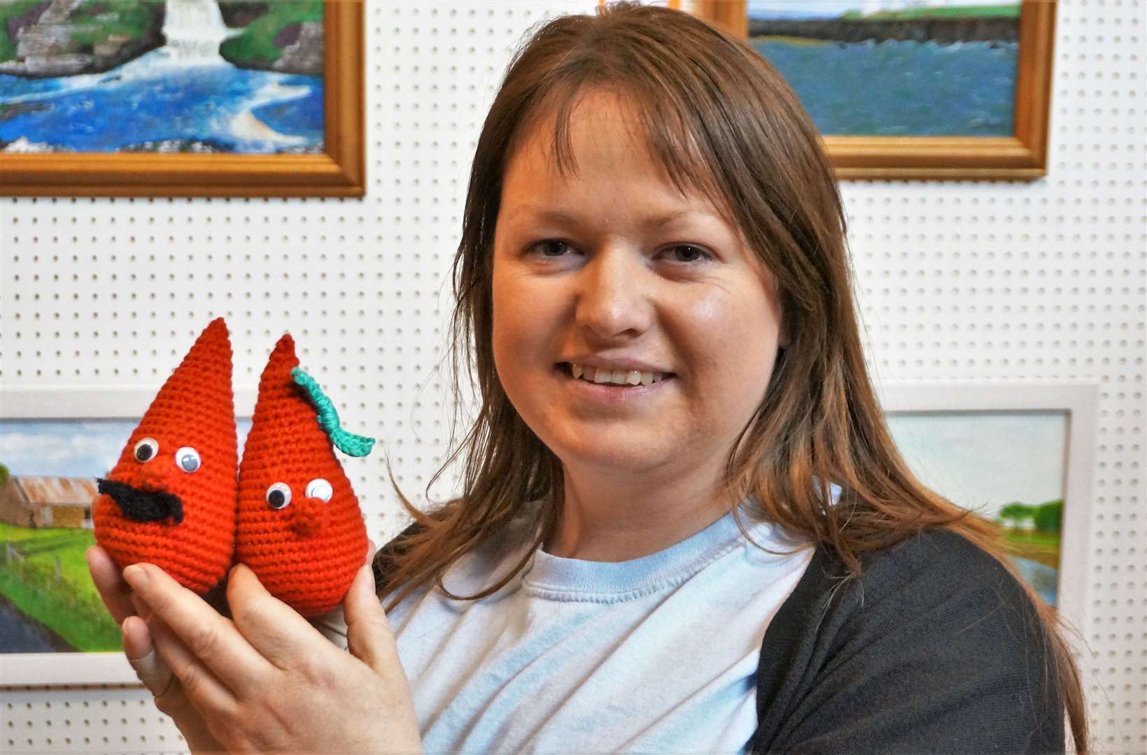 Joy Jackson with the Mr and Mrs Blood Drop toy gonks she knitted. Picture: DGS