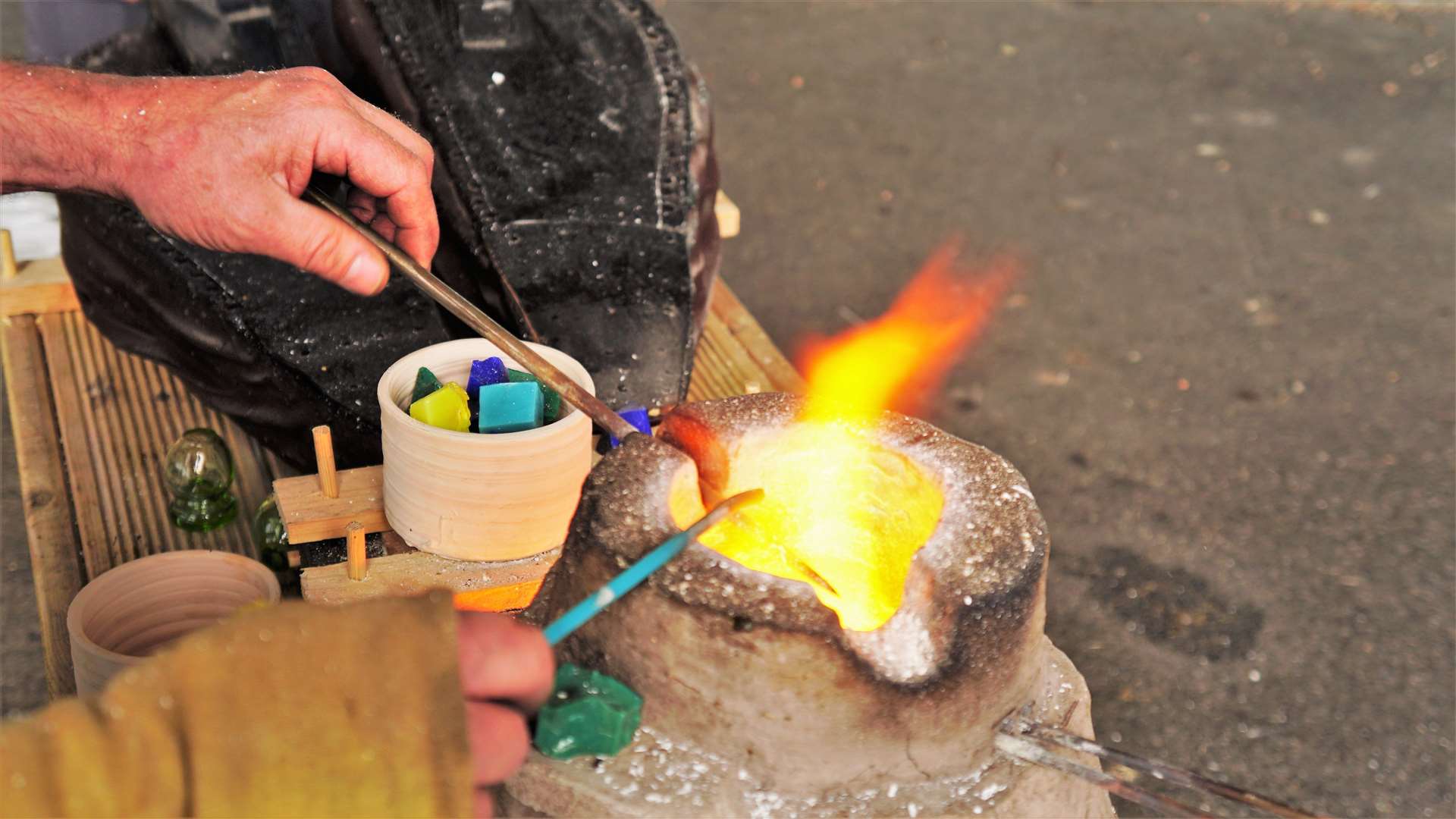 Glass artist Michael Bullen had a special furnace and was trying to recreate the patterned glass bead recovered in an archaeological dig at Swartigill this year. Picture: DGS