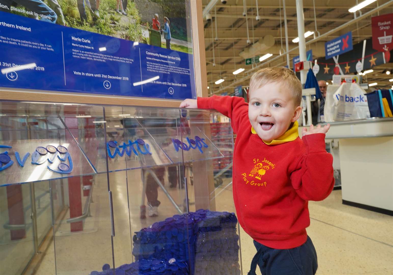 A young customer casts his vote in a Tesco store. Picture: Aaron McCracken