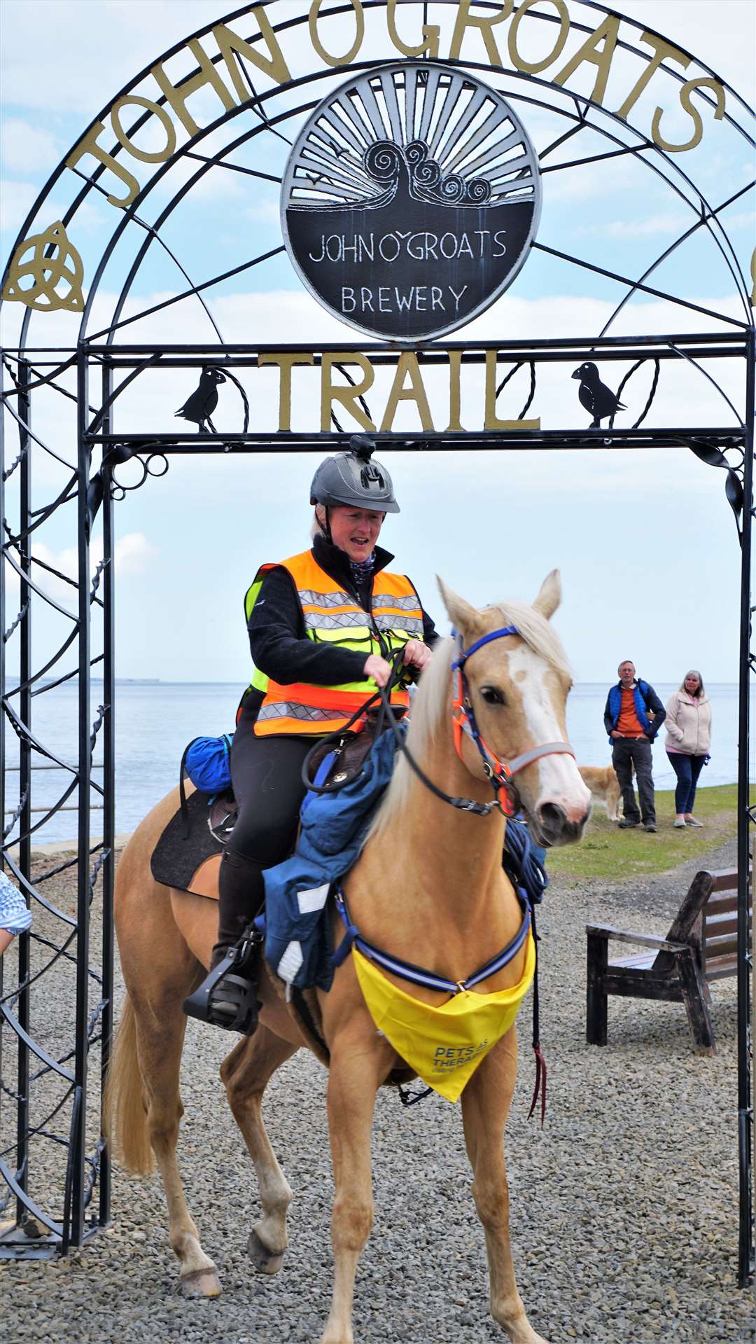 Kate steadies Marilyn as they ride under the archway at Groats with little headroom to spare. Picture: DGS
