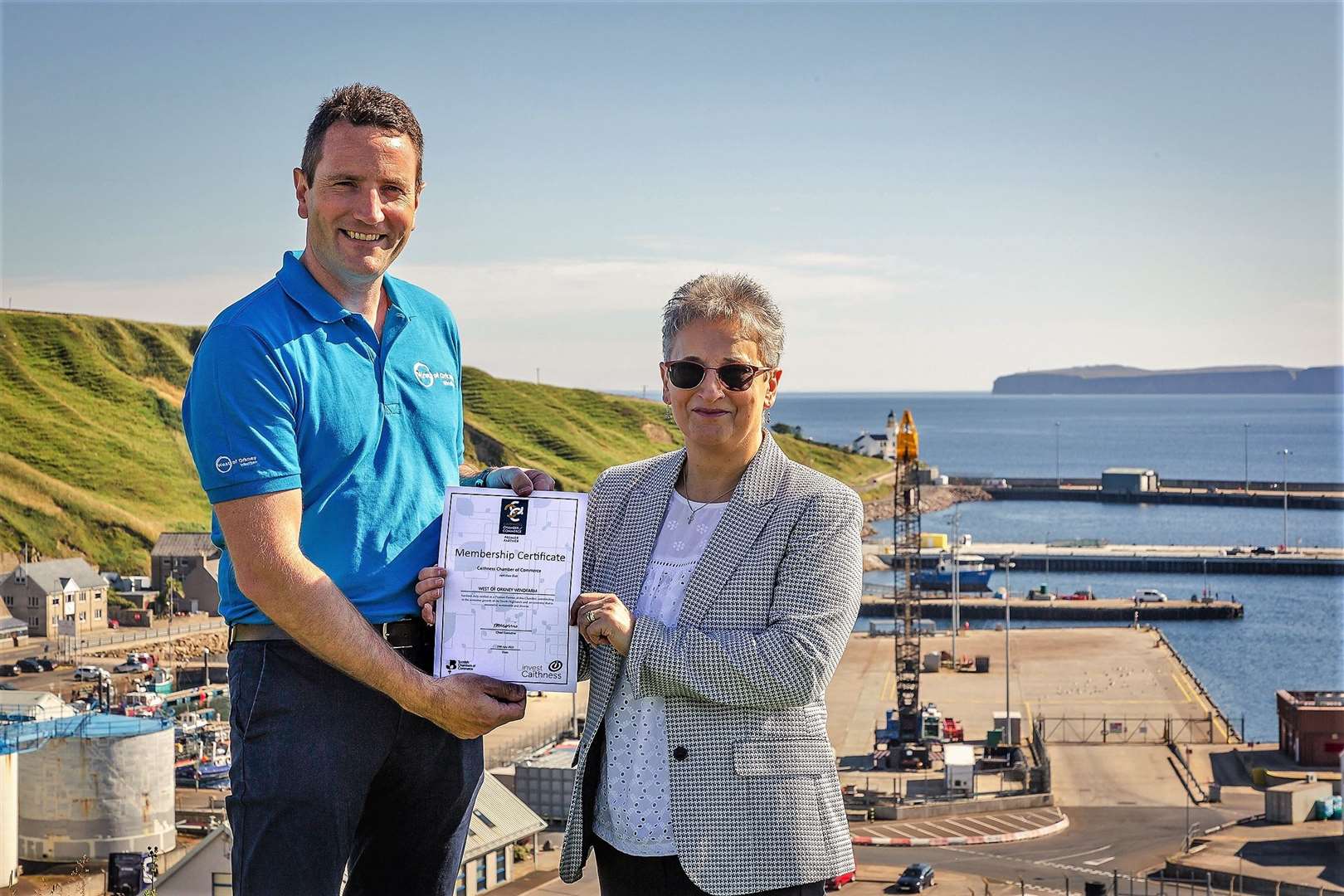 Project development manager Jack Farnham with Trudy Morris from Caithness Chamber of Commerce at Scrabster Harbour.