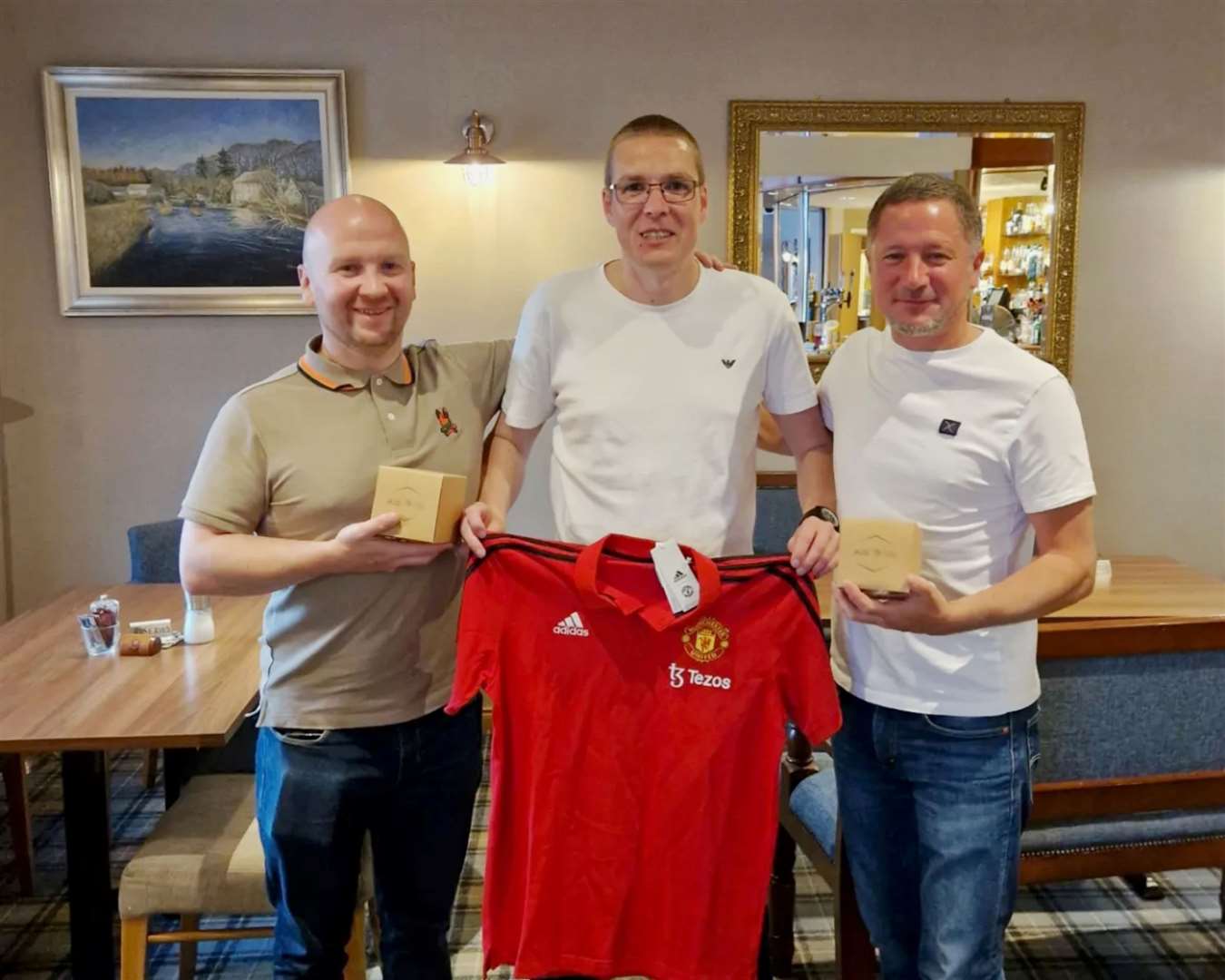 Alyn Gunn (centre) of AG Coaching with Manchester United academy coaches Neil Scott (left) and Gabe Mellor.