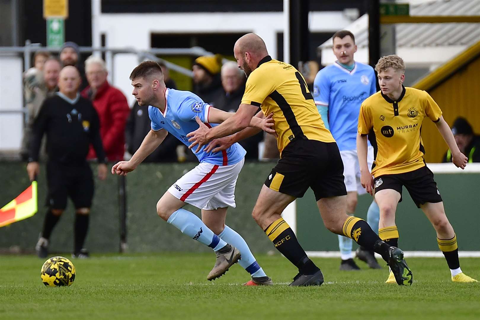 Wick Academy's Marc Macgregor holds off Nairn defender Ross Tokely. Picture: Mel Roger