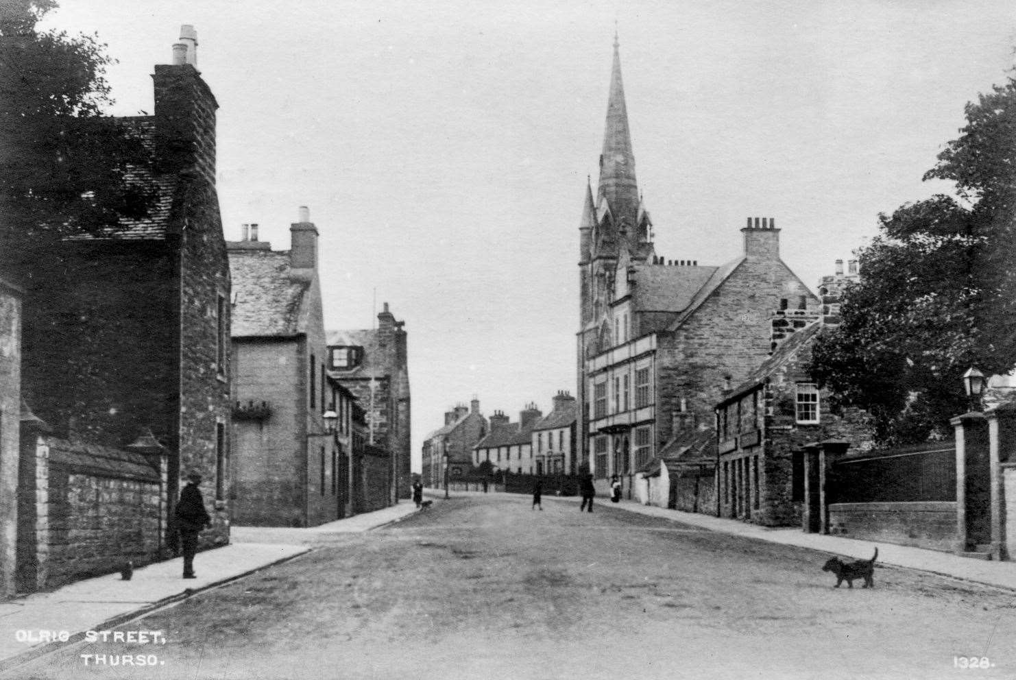 Postcard view of Olrig Street in Thurso, postmarked 1911, with a few pedestrians and a solitary dog. Beach Road was known as Davidson's Entry at the time. Henrietta Munro Collection