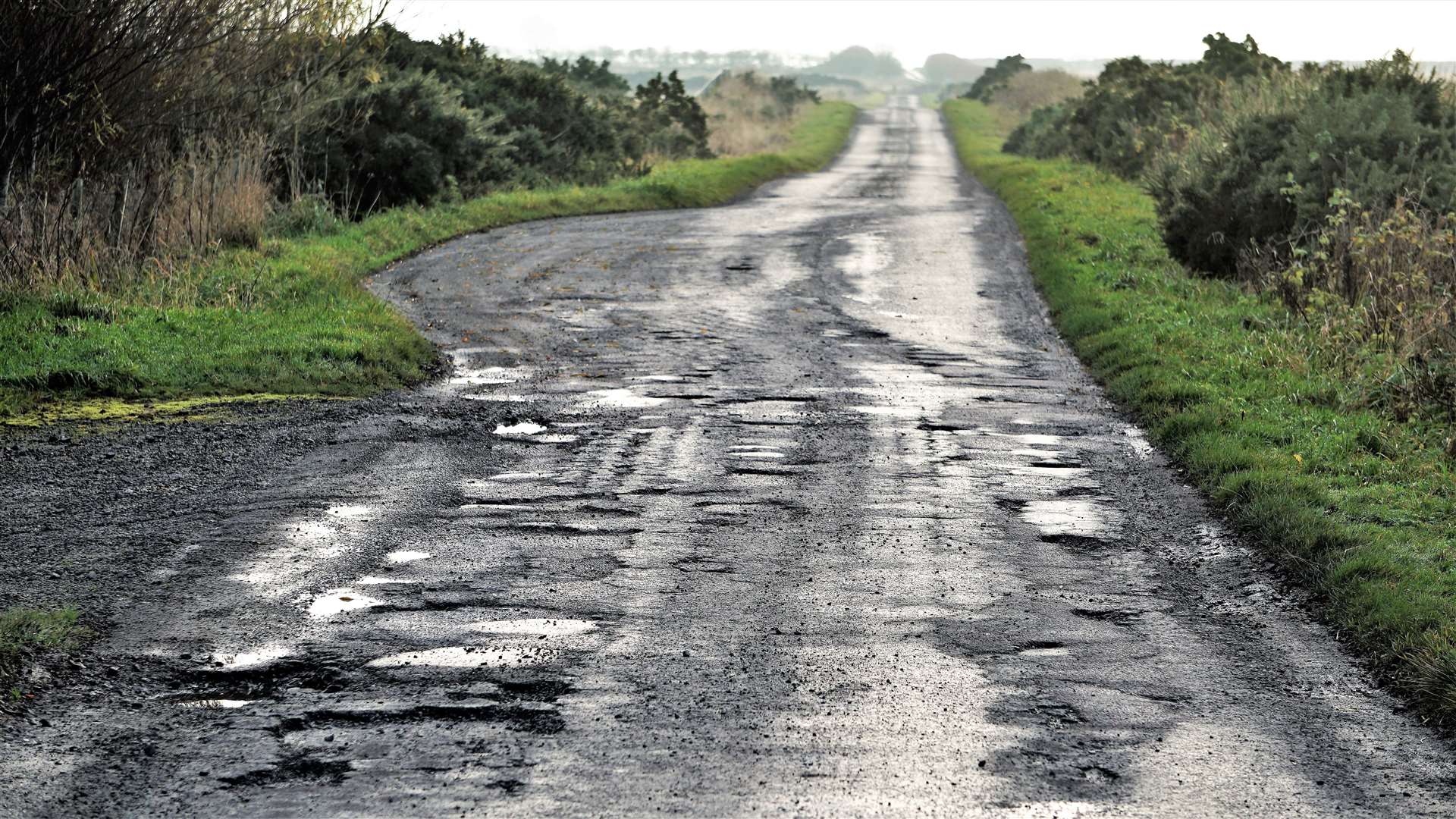 Potholes on a road in the Bower area. Picture: DGS