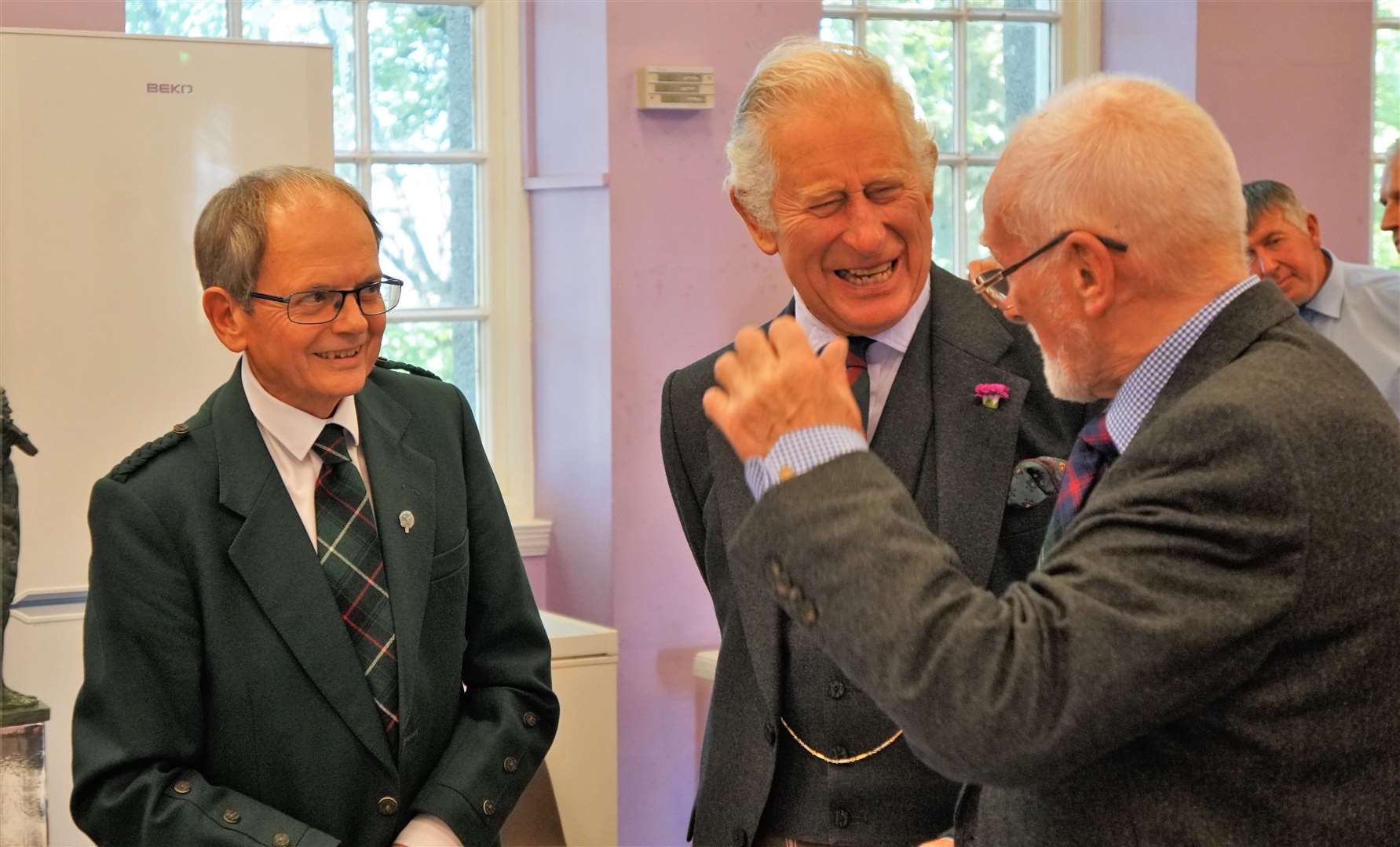 HRH showed his jovial nature as he speaks to Edward Atkins, a retired fisherman and committee member on the Seafarers Memorial Group. John Bogle, from the group, is at left. Picture: DGS