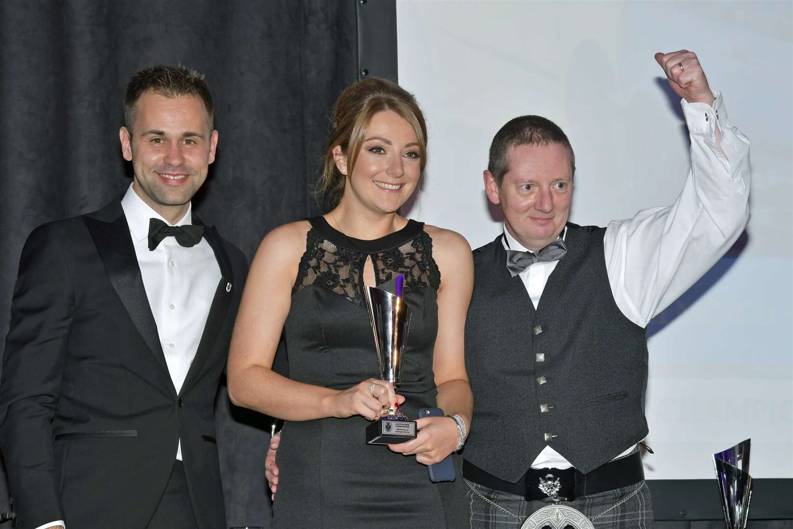 Ashleigh with dad Cammy with the Best Prepared BMW award. On the left is British GT Championship winner Jonathan Adam. Photo: Jim Moir