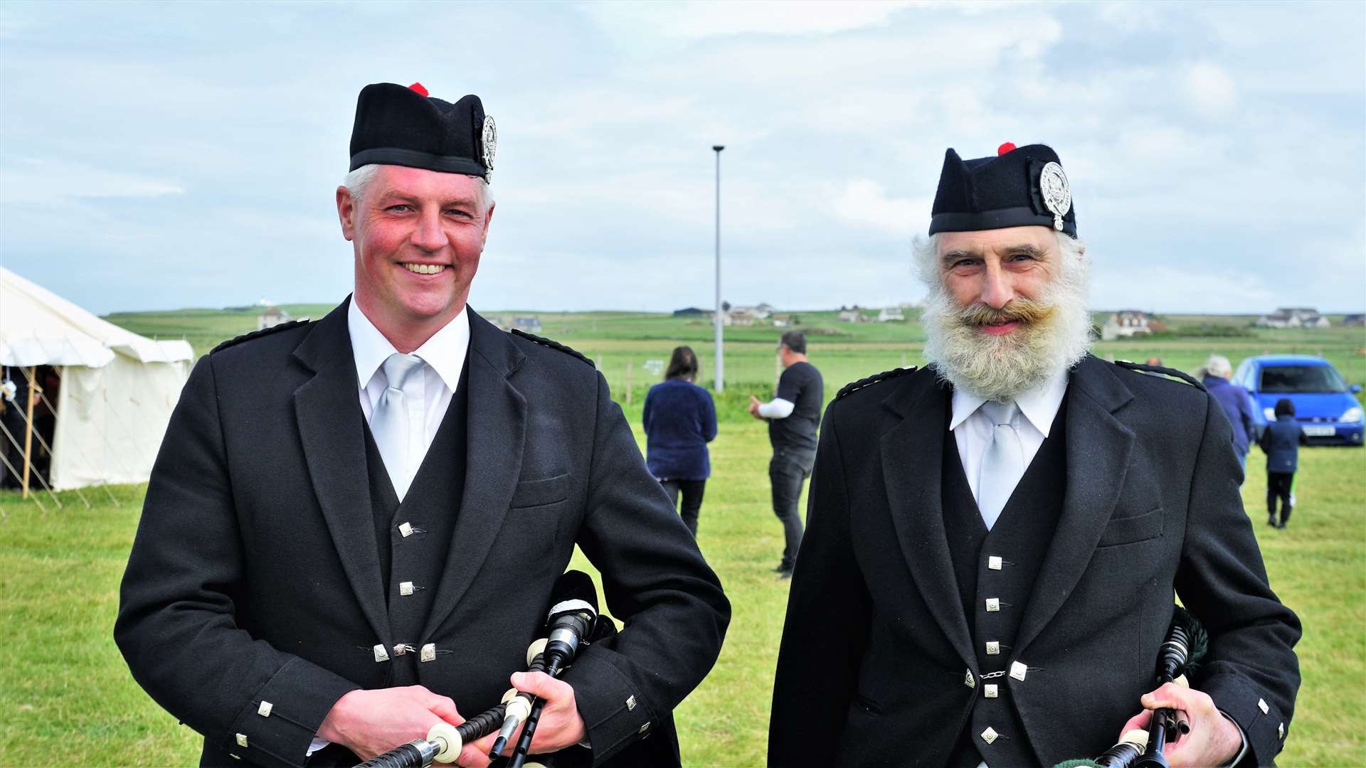 Wick's pipe band convener Colin Mackay, left, with Dr Robin Wybrew who joined the band in 2019. Dr Wybrew was also displaying his 1965 Morris Minor which he frequently uses for trips to Caithness General Hospital where he works. Picture: DGS