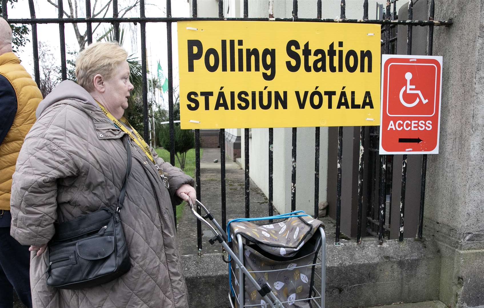 Members of the public arrive at the polling station in scoil Treasa Naofa on Donore Avenue, Dublin, on Friday (Gareth Chaney/PA)