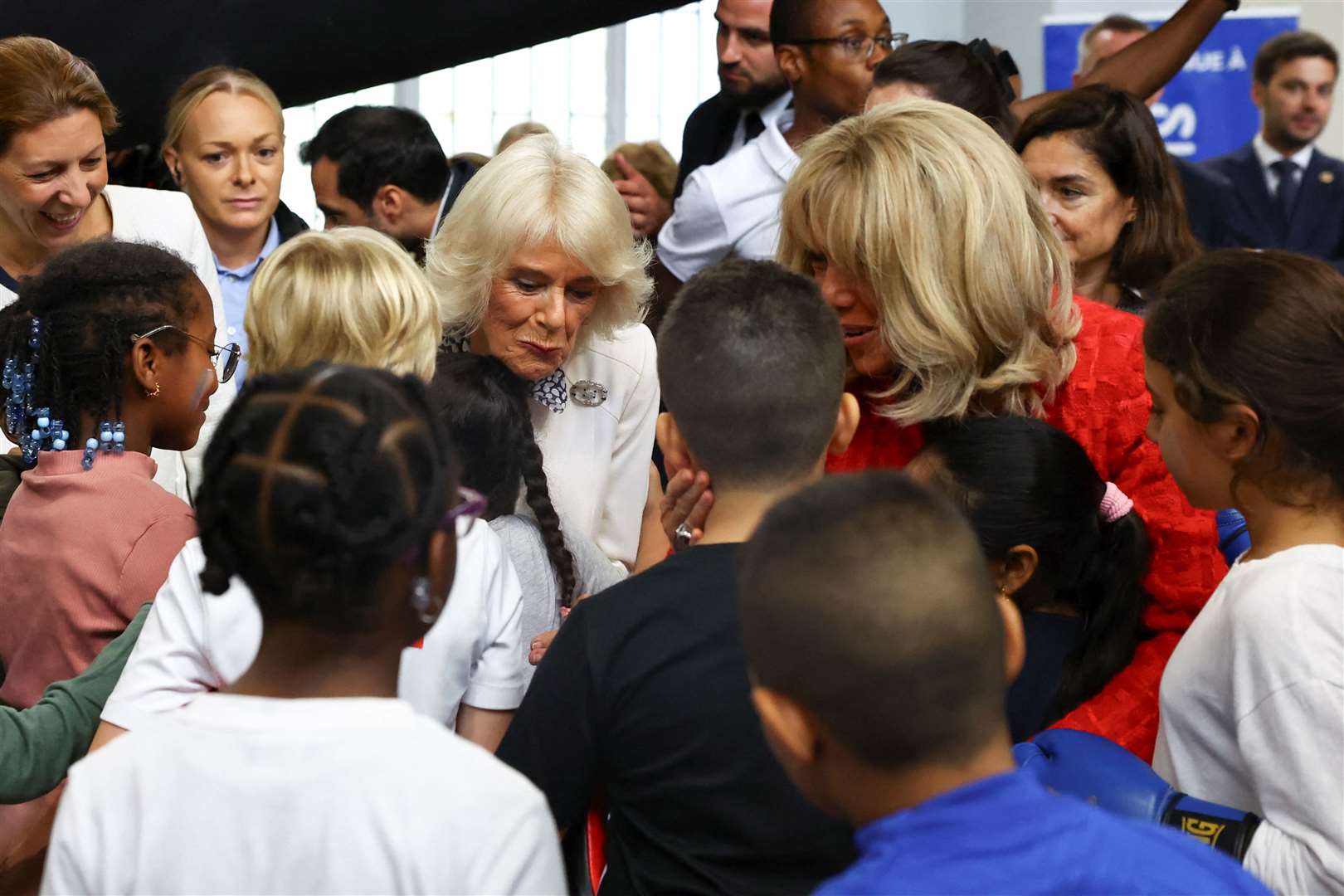 The Queen and Brigitte Macron meet young athletes in Saint-Denis (Hannah McKay/PA)