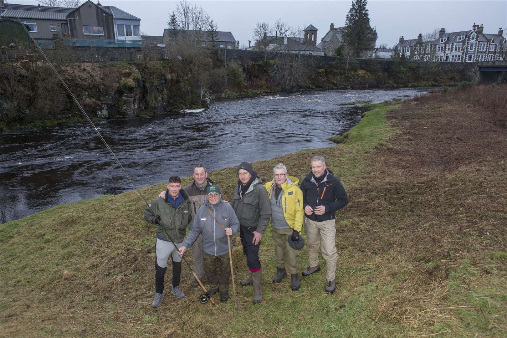 Glasgow doctor Mike Leach (centre), who has been fishing the River Thurso for the past 41 years, with some of the group of anglers from the Glasgow area whom he has introduced to the river. They make three journeys north each fishing season and this year the honour of toasting the river and casting the first fly of the season went to two members of the group. Freddie Sutherland (foreground), an 81-year-old landscape gardener, cast the first fly, while Peter Duncan (second left) toasted the river. Picture: Robert MacDonald / Northern Studios