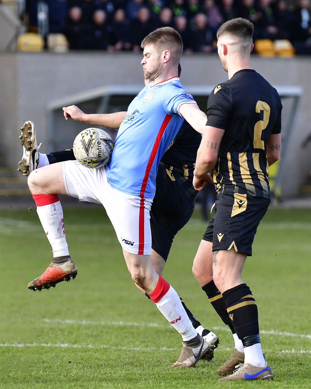 Marc Macgregor controls the ball under pressure from Huntly's James Connelly. Picture: Mel Roger