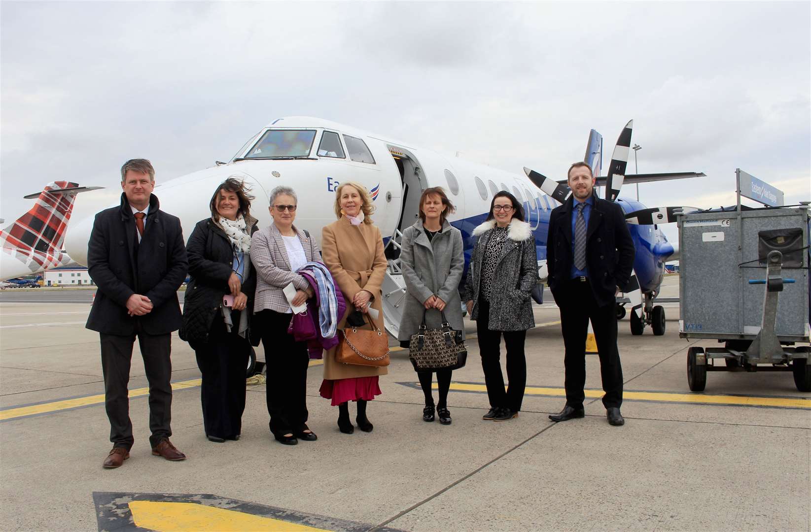 Preparing to board at Aberdeen Airport are, from left, Dougie Cook (HIAL), Lorna Jack (HIAL), Trudy Morris (Caithness Chamber of Commerce), Ellie Lamont (Venture North), Louise Sinclair (Caithness Chamber of Commerce), Marion Reid (Caithness Chamber of Commerce) and Gordon Duncan (Highland Council). Picture: Alan Hendry