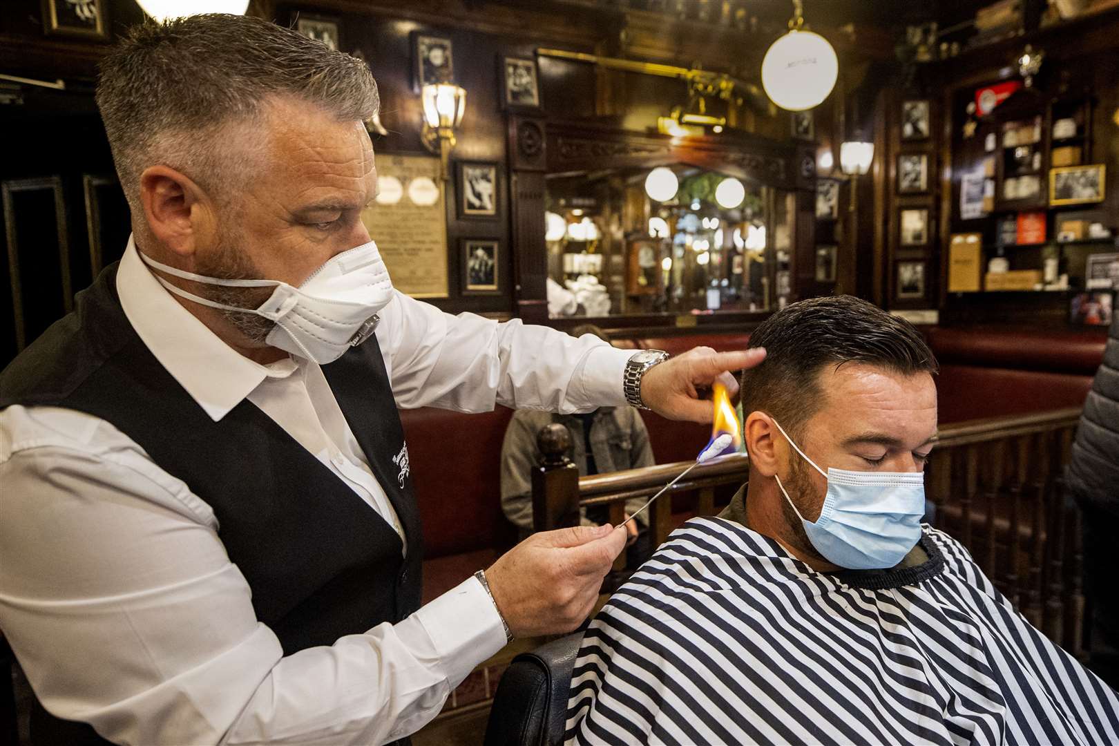 People in Northern Ireland can get their hair cut from Friday as hairdressers reopen (Liam McBurney/PA)