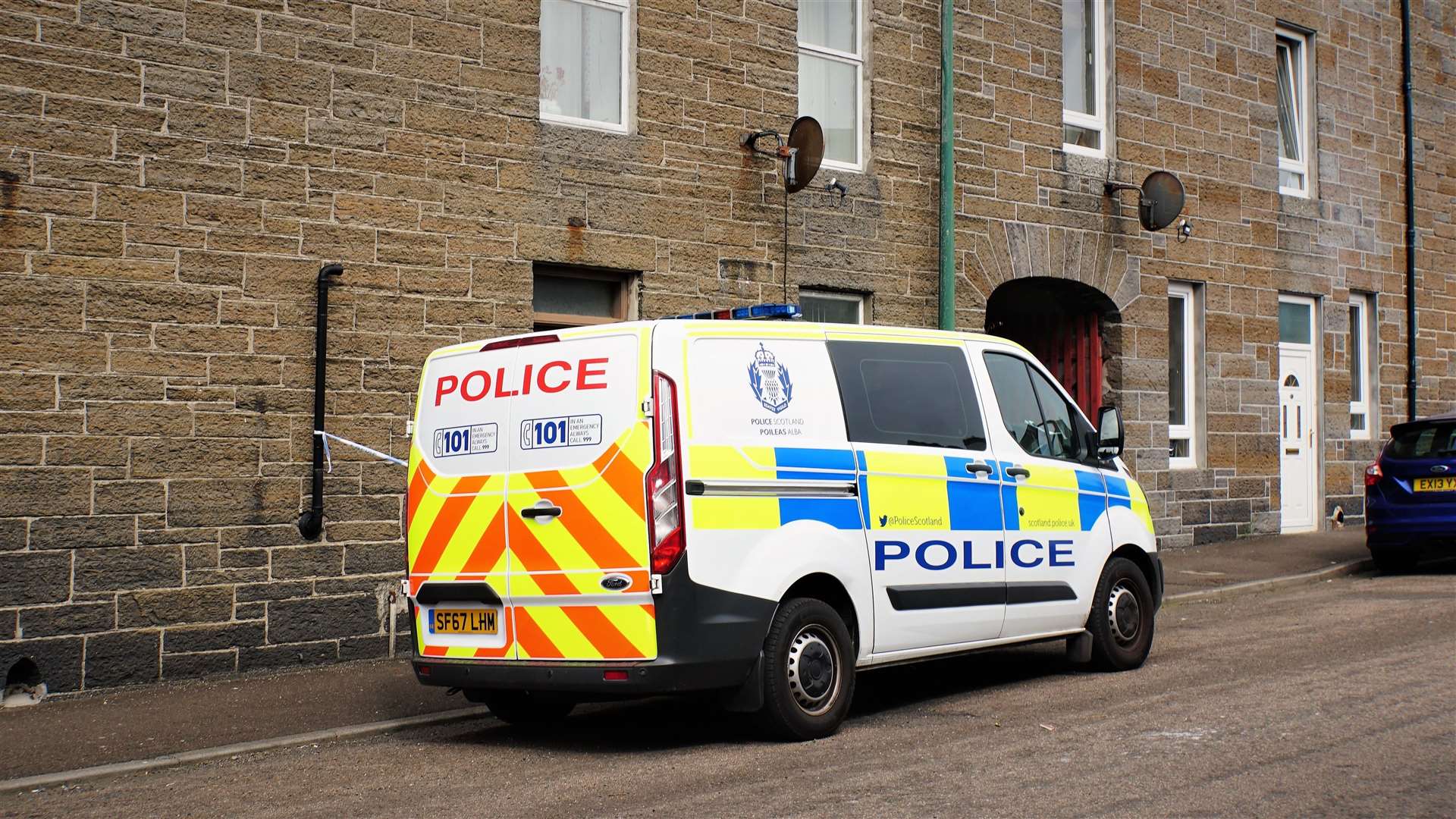 A police van outside the property in Wick's Barrogill Street on Wednesday. Picture: DGS