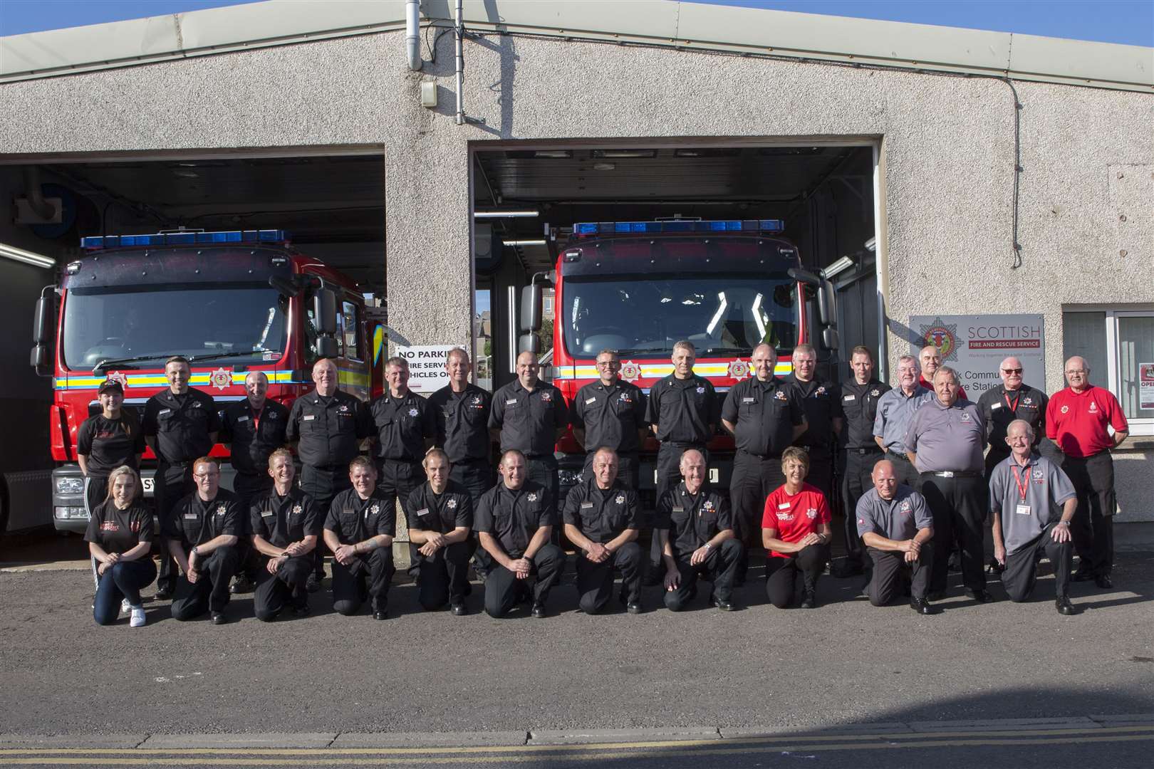 At the end of the Wick fire station open day, the Wick firefighters pose for a group photograph along with some of their other fire service colleagues and others who helped make day a success. Picture: Robert MacDonald / Northern Studios