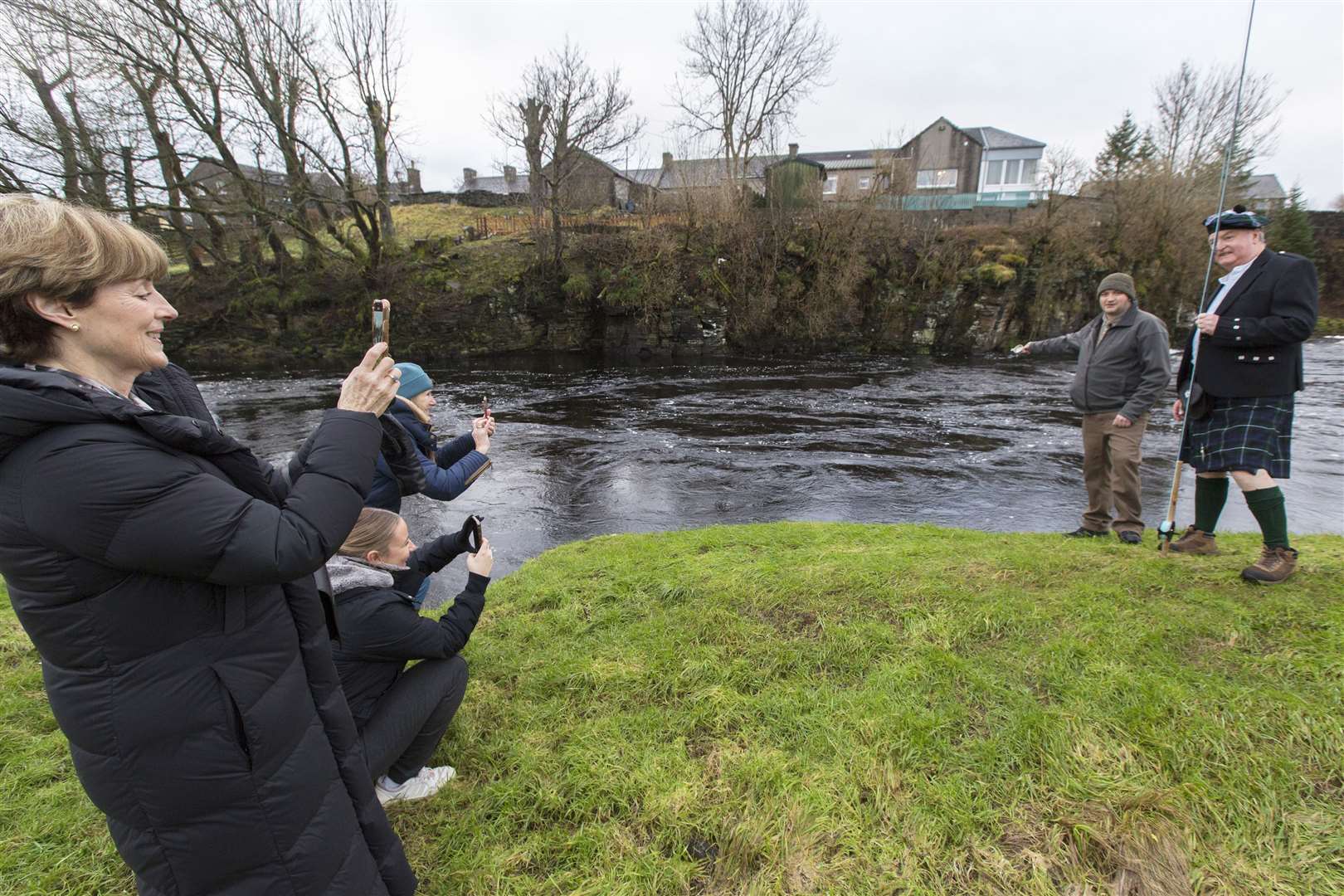 One for the family album: Linda Graham takes a snapshot of her husband John, who cast the first fly, and senior ghillie Geordie Doull, who gave the toast to the River Thurso. Picture: Robert MacDonald / Northern Studios