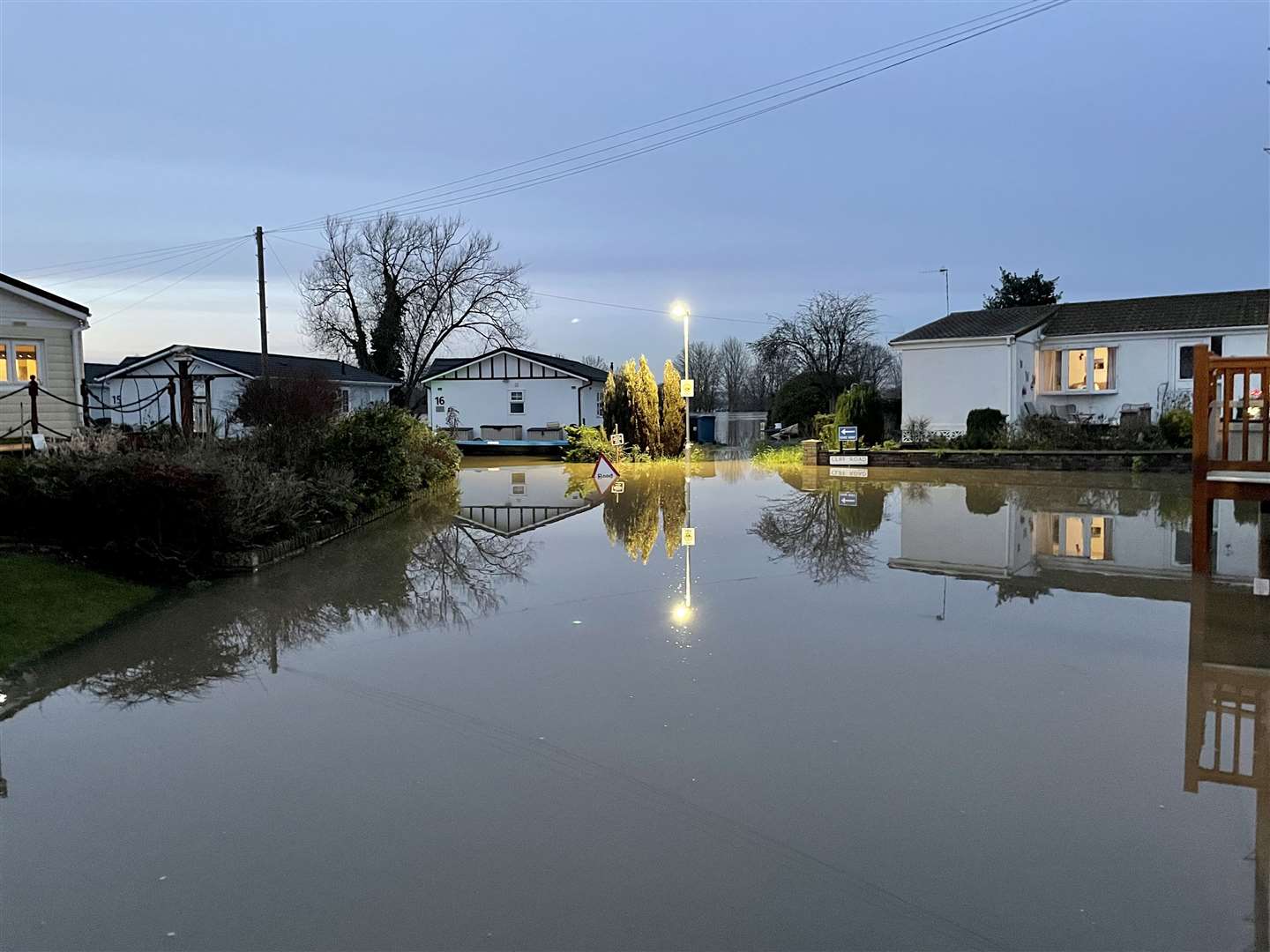Floodwater surrounds houses in Summer Way, Radcliffe-on-Trent, Nottinghamshire (Callum Parke/PA)