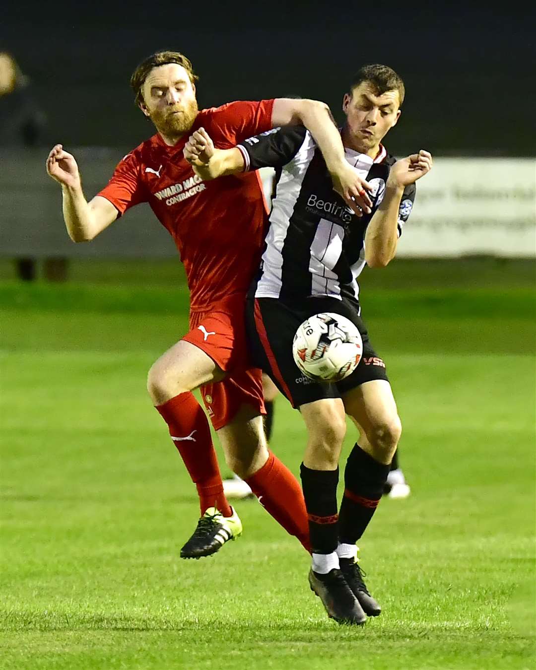 Wick Academy's Ryan Campbell tries to fend off Dale Gillespie of Brora Rangers during the North of Scotland Cup derby at Harmsworth Park on Wednesday night. Picture: Mel Roger