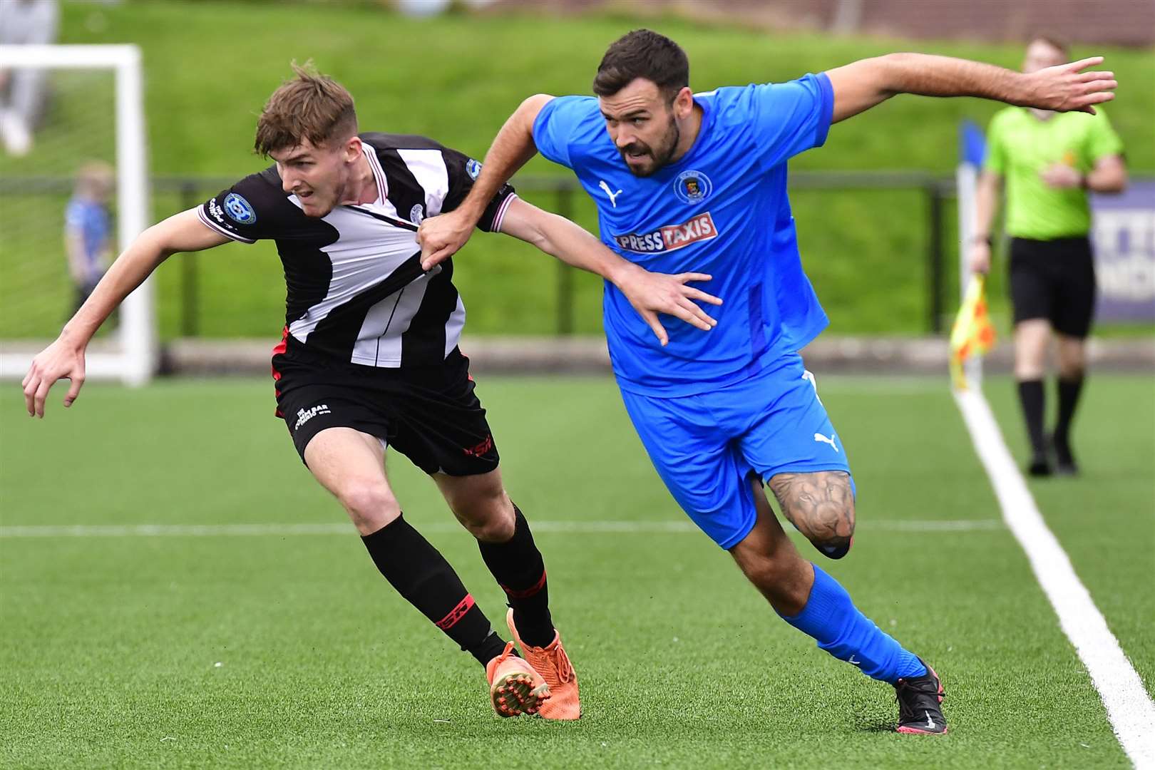 Bo'ness United's Nick Locke pulls back Wick Academy's Brandon Sinclair during the replay at Newtown Park on Saturday. Picture: Mel Roger