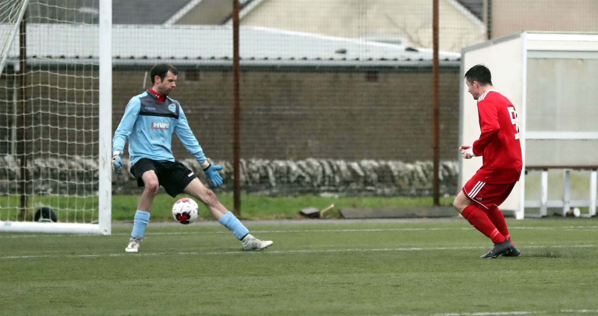 Conor Macintosh slots the ball through the legs of Bonar Bridge goalkeeper David Mitchell to score his second. Picture: James Gunn