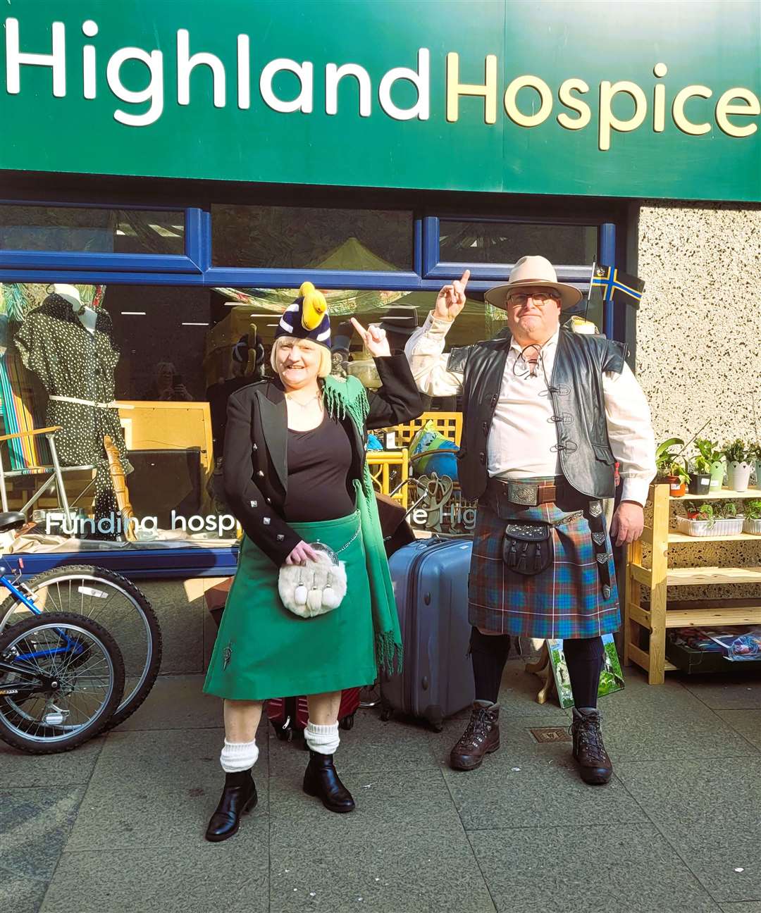 Highland Hospice charity shop worker Linda Mcgregor with David Bertrum who, together with his wife Anne, made baking for the tourists. Picture supplied