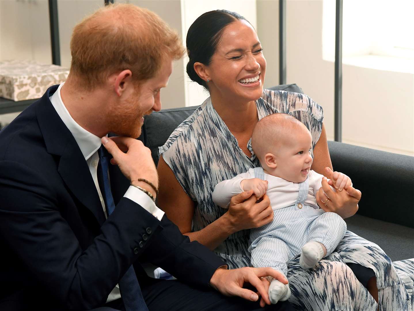 The Duke and Duchess of Sussex holding their son Archie (Toby Melville/PA)