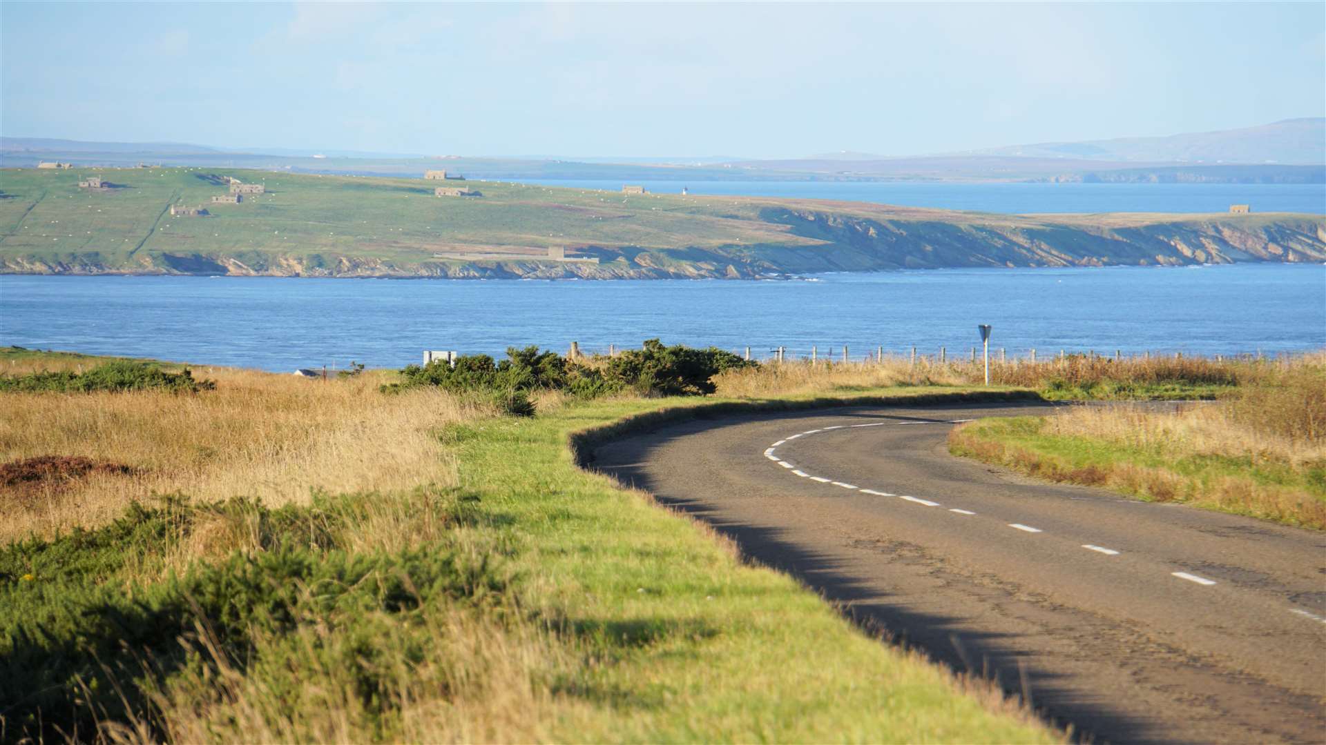 A road near John O'Groats with Stroma in the background.
