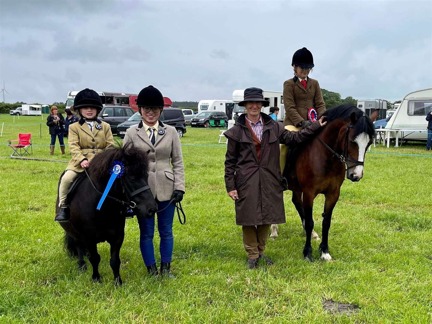 Mini working hunter champion Aimee Holmes and Abermenai Annie, and reserve Harriet Taylor with her Shetland, Farnorth Black Magnus, along with judge Sheila Stewart.