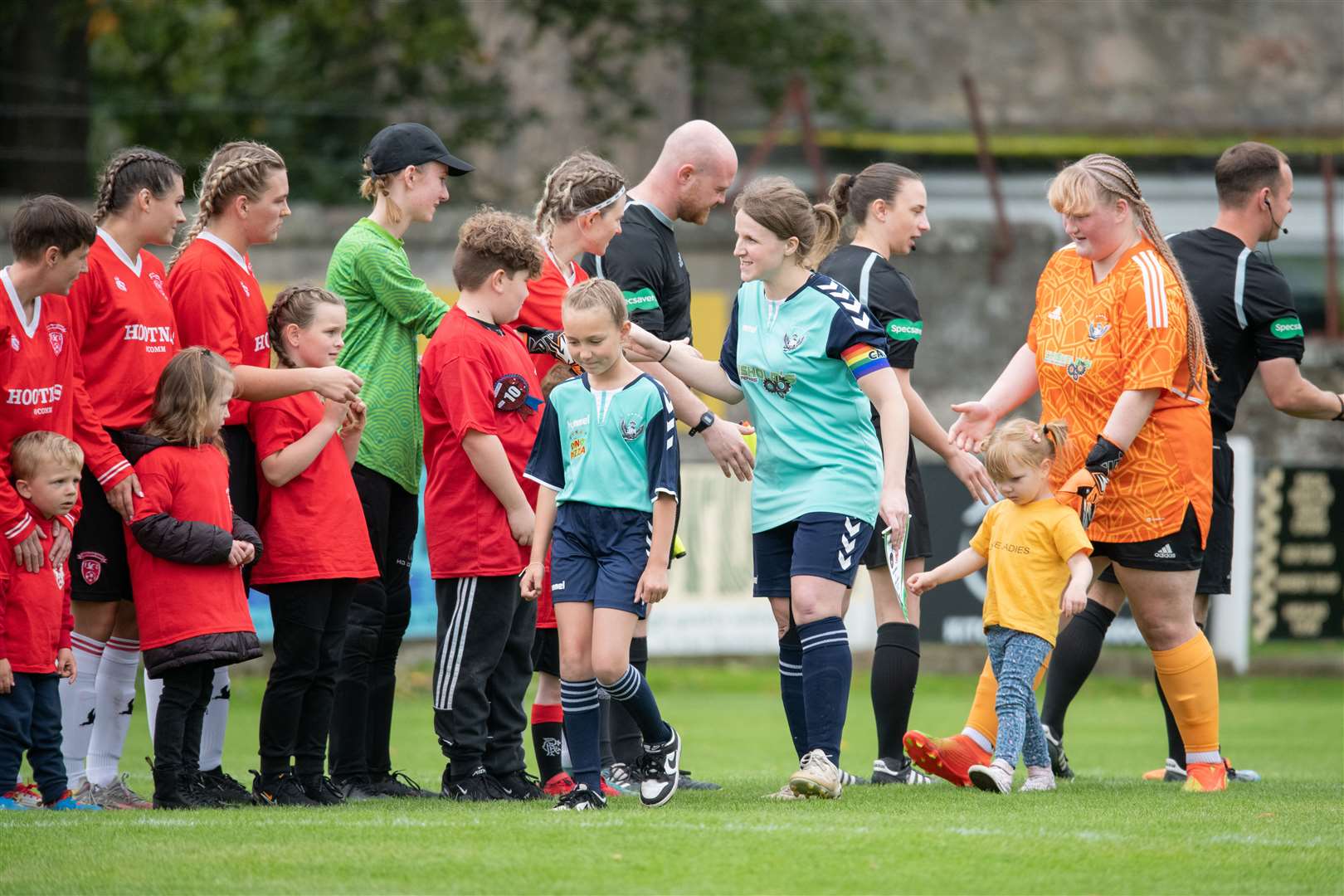 The teams shake hands ahead of the SWF Highlands and Islands League Cup final at Station Park, Nairn. Picture: Daniel Forsyth