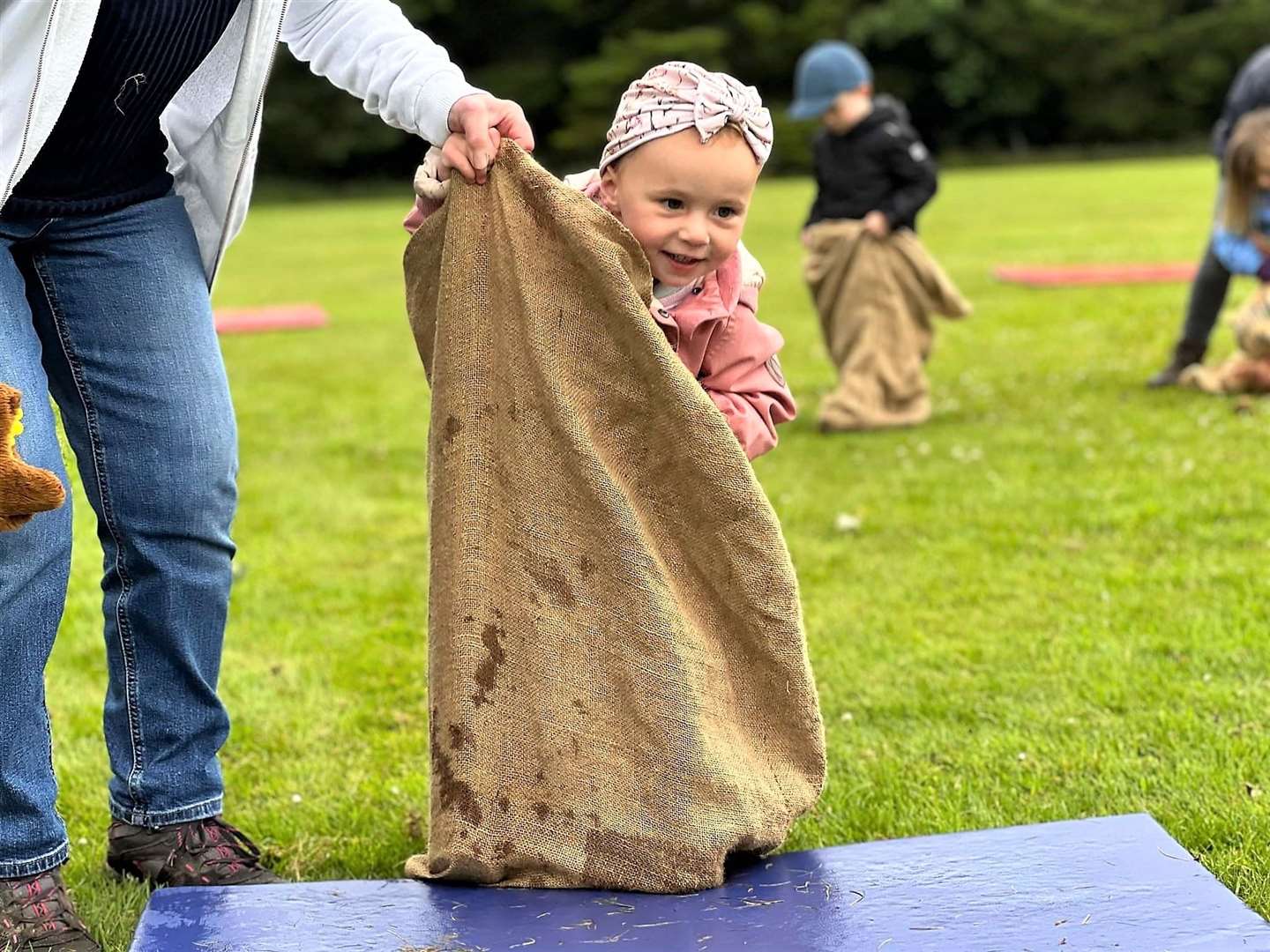 Anna enjoys the sack race at Bower Busy Bees nursery. Picture: Andrea O'Kane