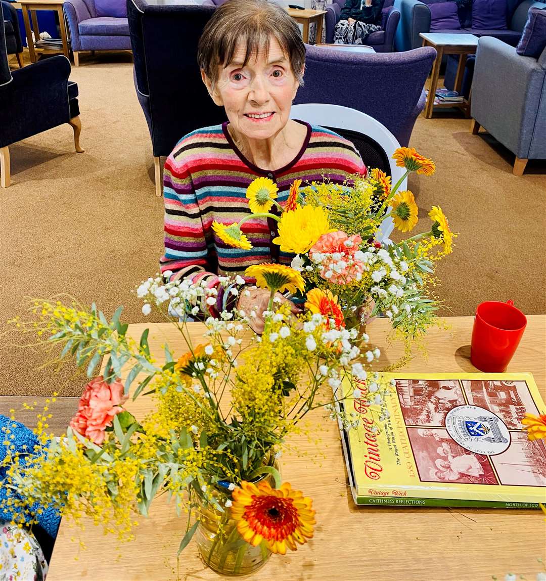 Marna making floral displays.