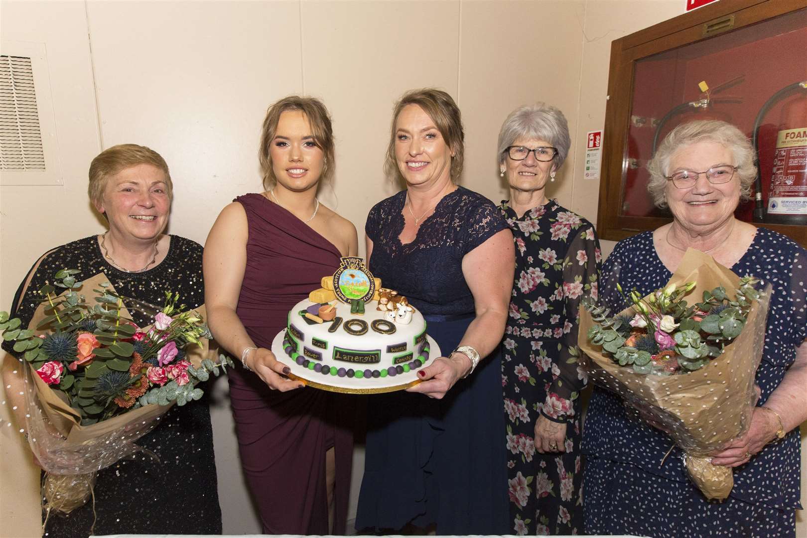 Five past members of the former Watten Young Farmers and a young Bower member who is from the district baked the main cake and three other smaller cakes, along with various other tasty items, for the centenary ball. The three smaller cakes were served following the dinner and the main cake went into a prize draw. With the main cake are (from left) Margaret Brims, Isla Mackay, her mum Meg Mackay, Helen Campbell and Eva Swanson. Alison McDonald, who made tablet, was unable to attend. Picture: Robert MacDonald / Northern Studios