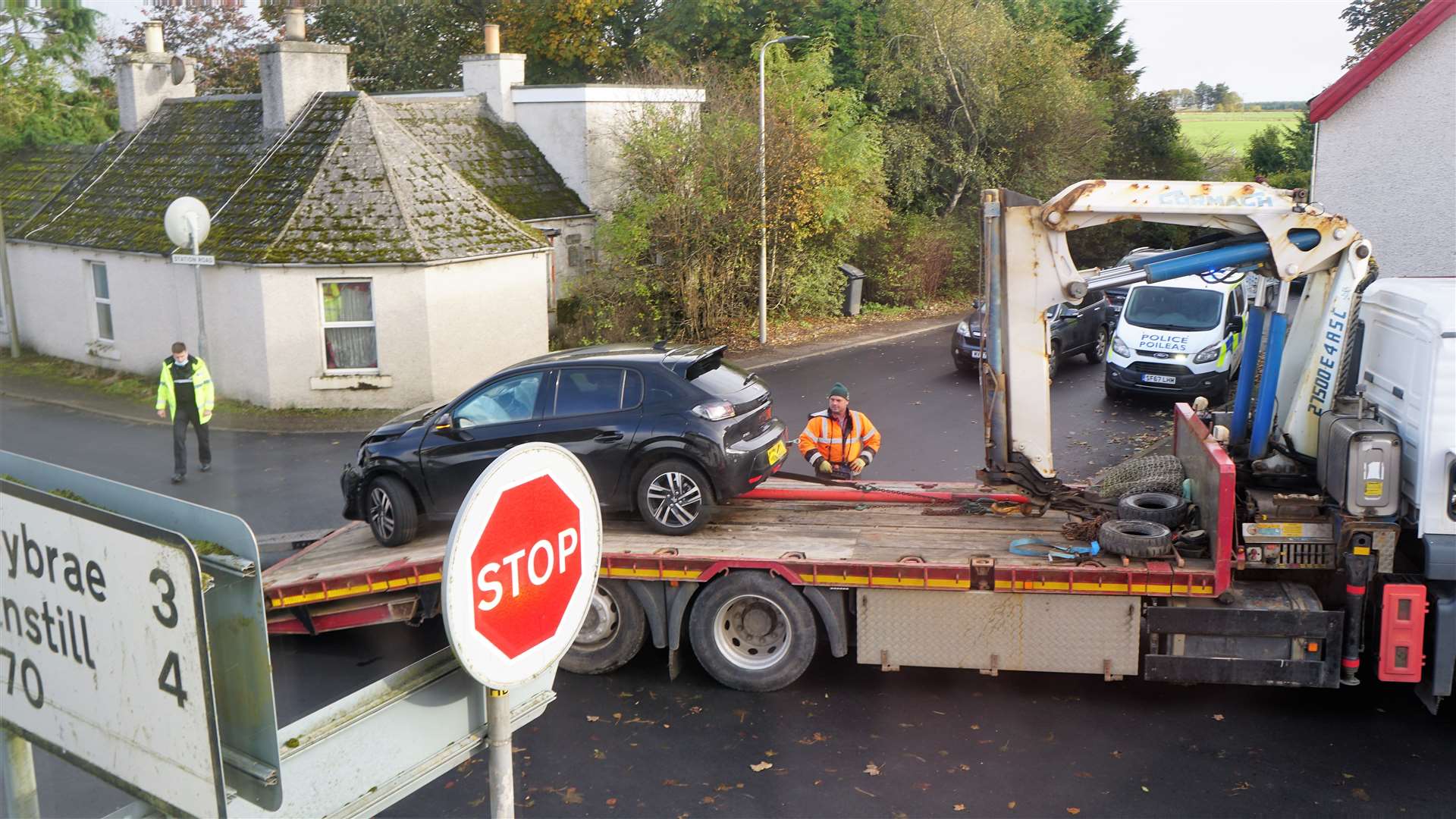 A car is uplifted after another incident at the unmarked crossroads in October last year.