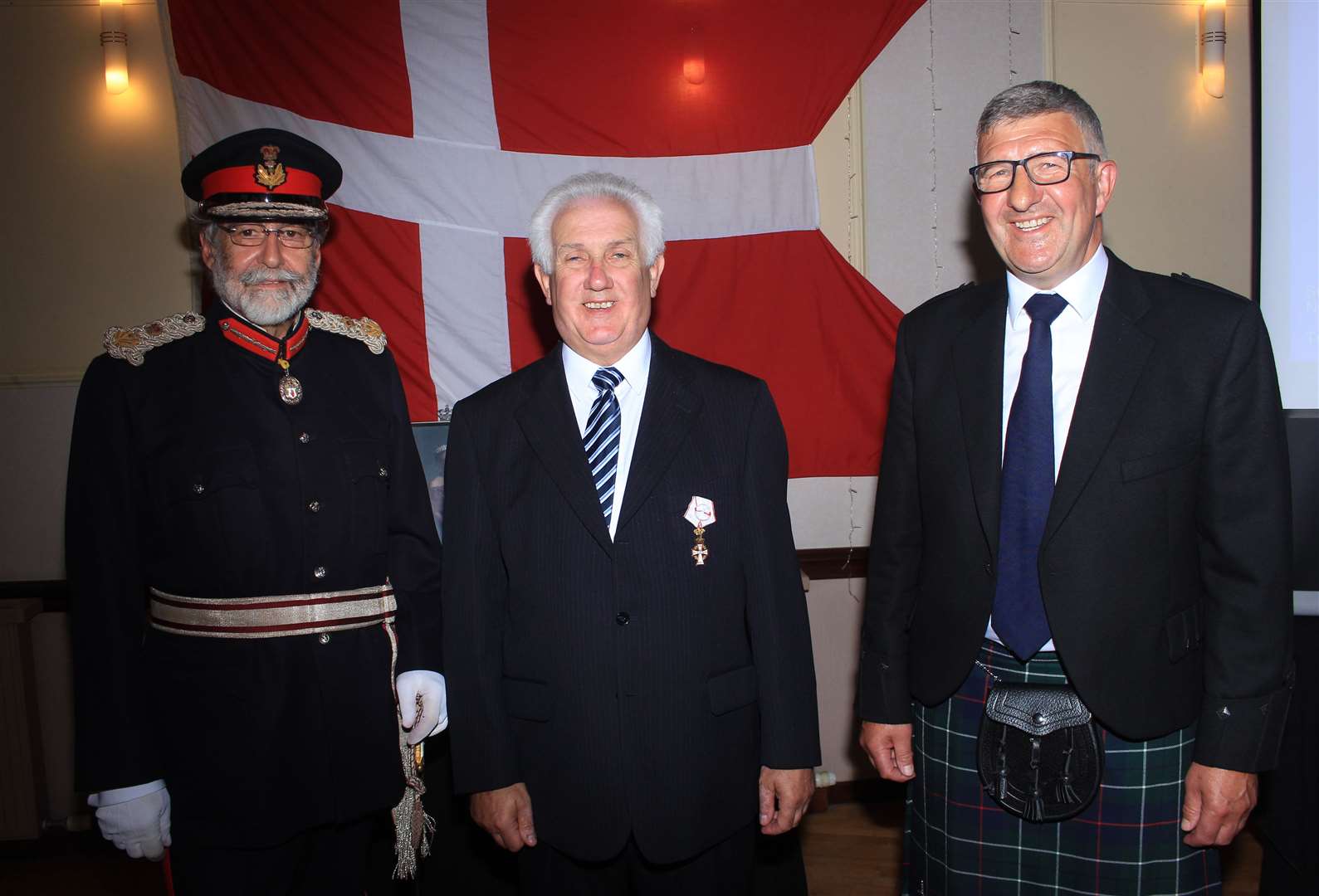Malcolm Bremner (centre) after receiving the Knight’s Cross of First Class of the Order of Dannebrog, with the Lord-Lieutenant of Caithness, Lord Thurso, and Vice-Lieutenant Willie Watt. Picture: Alan Hendry